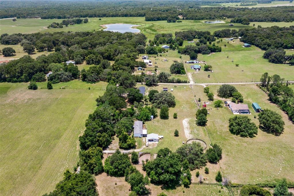 26255 Lambeth Road Brooksville, FL 34601 - Photo 74 of 76 an aerial view of a houses with a yard