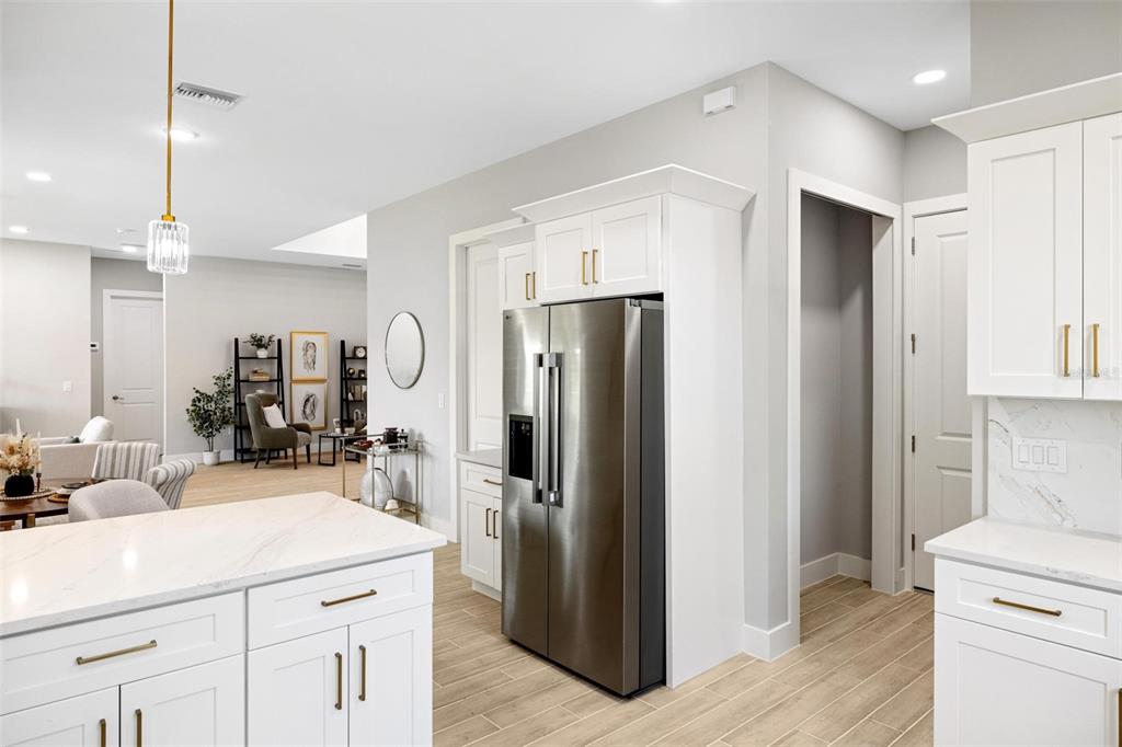 38 Lark Drive Placida, FL 33946 - Photo 20 of 46 a kitchen with a refrigerator sink and cabinets
