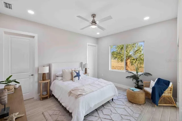 a bedroom with a bed and window