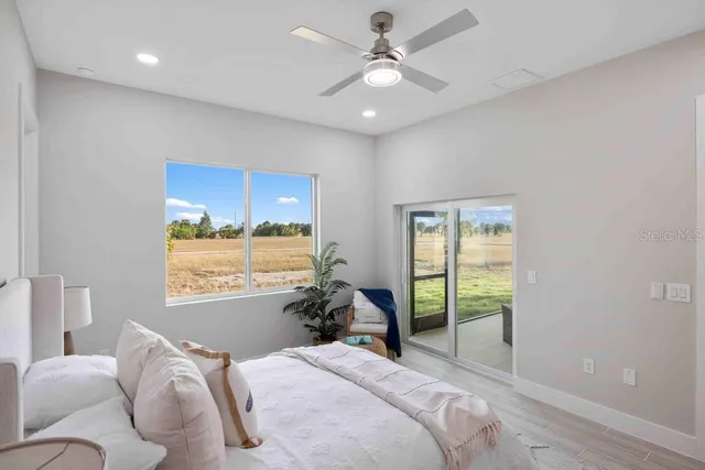 a bedroom with a large bed and a window