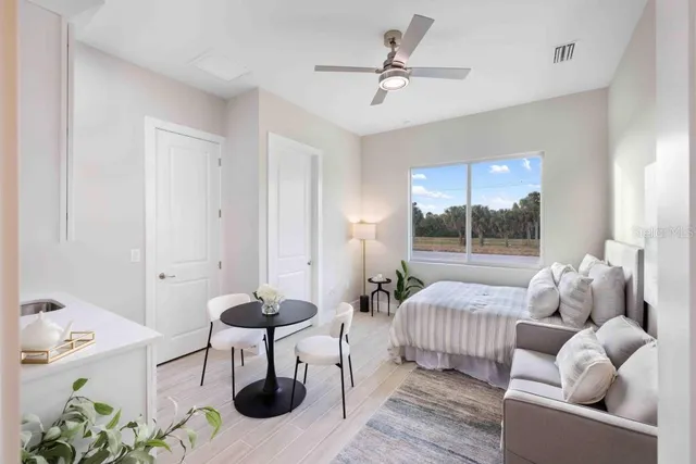 a living room with furniture and a large window
