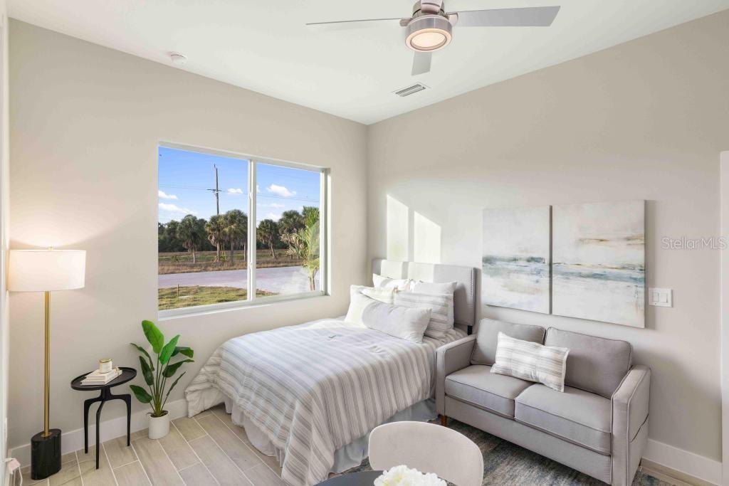 38 Lark Drive Placida, FL 33946 - Photo 29 of 46 a spacious bedroom with a bed and a couch