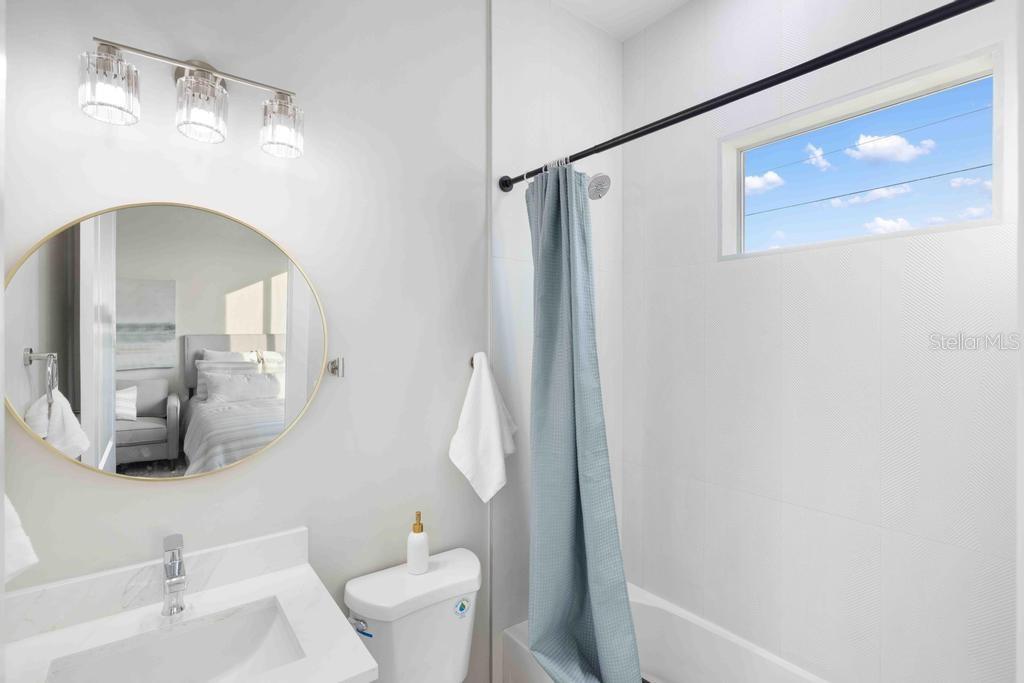 38 Lark Drive Placida, FL 33946 - Photo 30 of 46 a bathroom with a sink a toilet and shower
