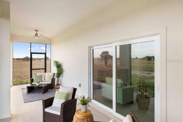 a living room with large windows