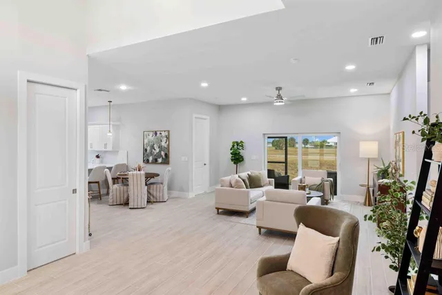 a living room with furniture or couch and a large window