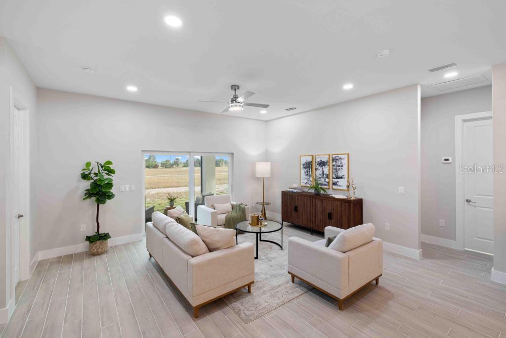38 Lark Drive Placida, FL 33946 - Photo 8 of 46 a living room with furniture and a potted plant