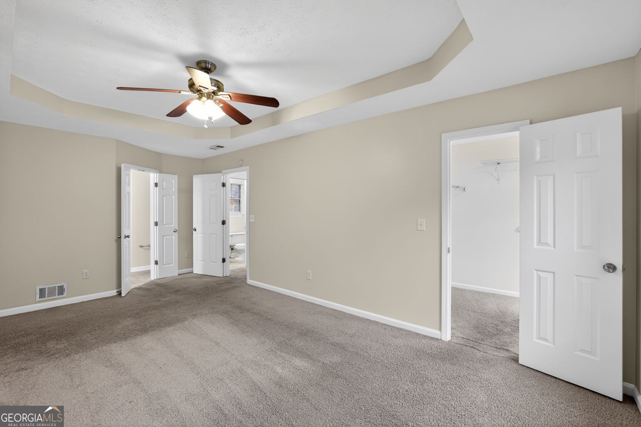 5635 Hunters Crossing Court Lithonia, GA 30038 - Photo 23 of 35 a view of an empty room and a chandelier fan