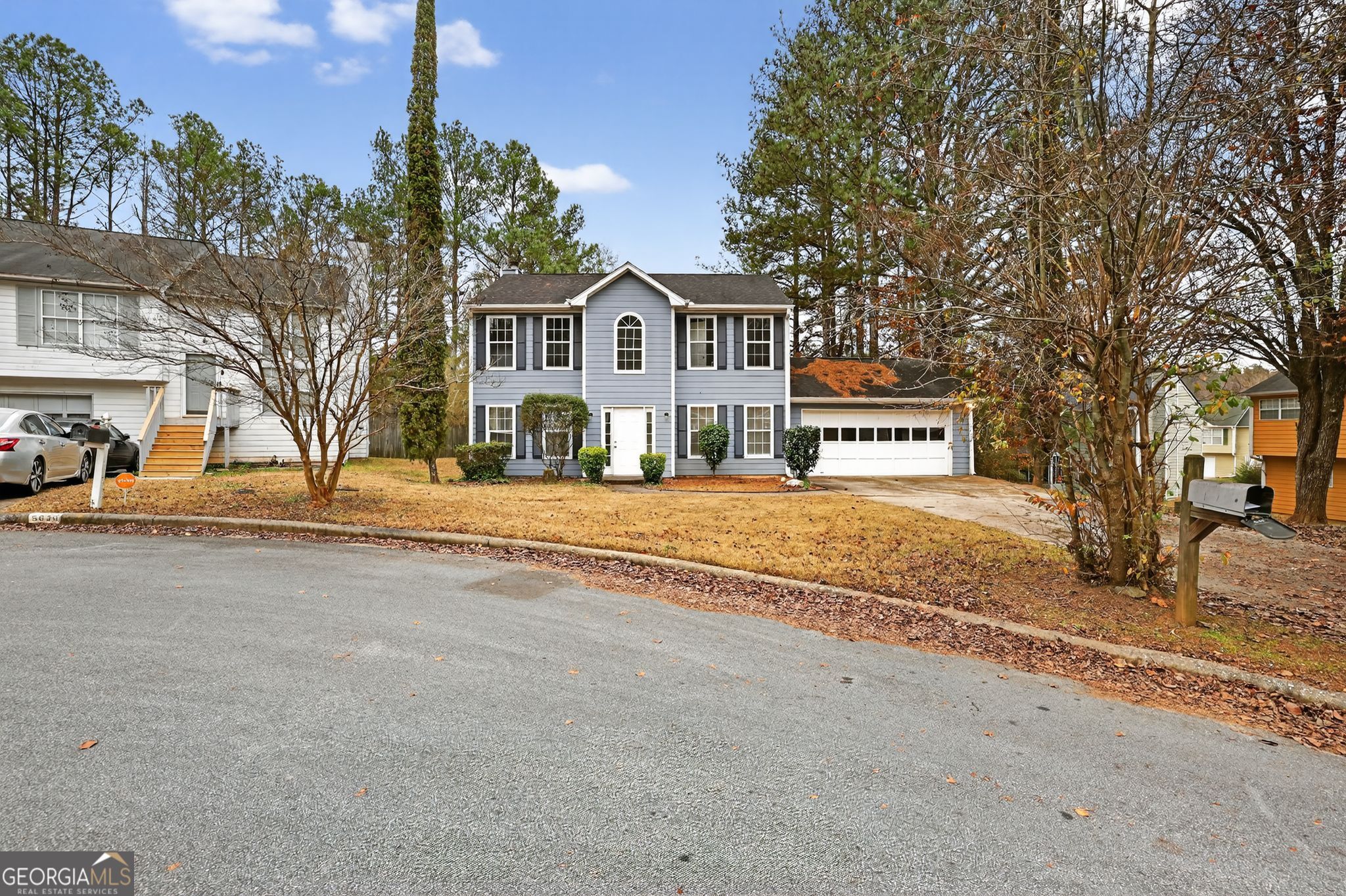 5635 Hunters Crossing Court Lithonia, GA 30038 - Photo 3 of 35 a front view of a house with a yard