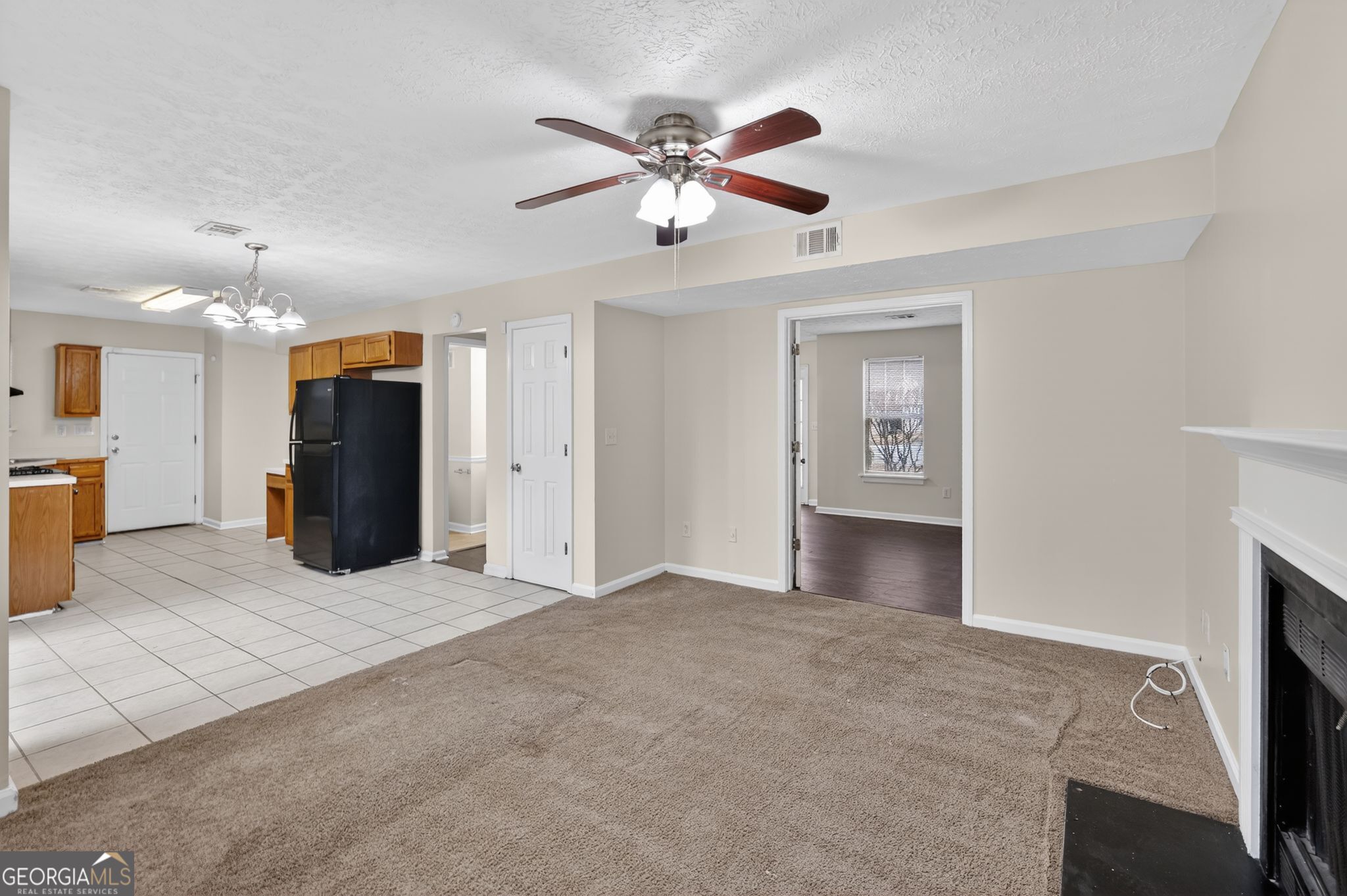 5635 Hunters Crossing Court Lithonia, GA 30038 - Photo 5 of 35 a view of an empty room with a ceiling fan