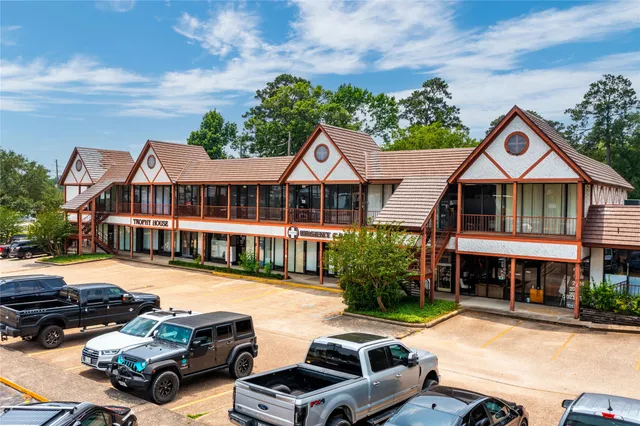 a front view of residential houses with yard