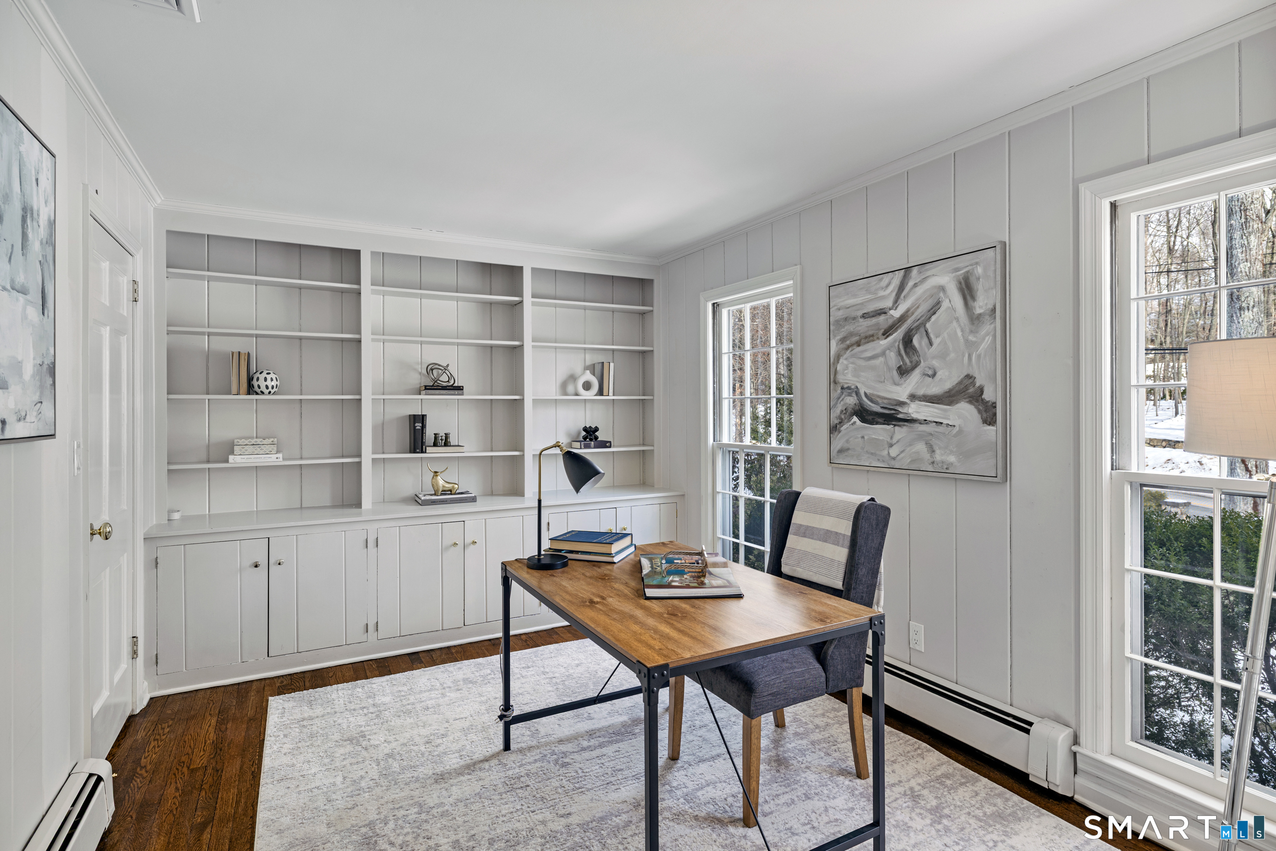 1038 West Road New Canaan, CT 06840 - Photo 17 of 37 a view of a workspace with furniture and a window