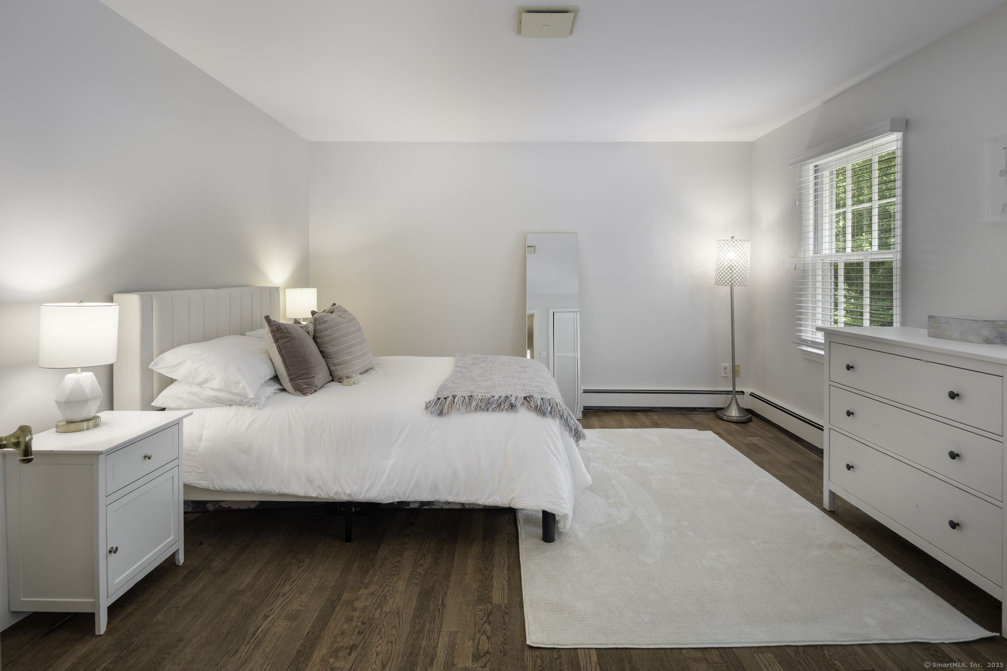 1038 West Road New Canaan, CT 06840 - Photo 25 of 37 a bedroom with a bed and a window