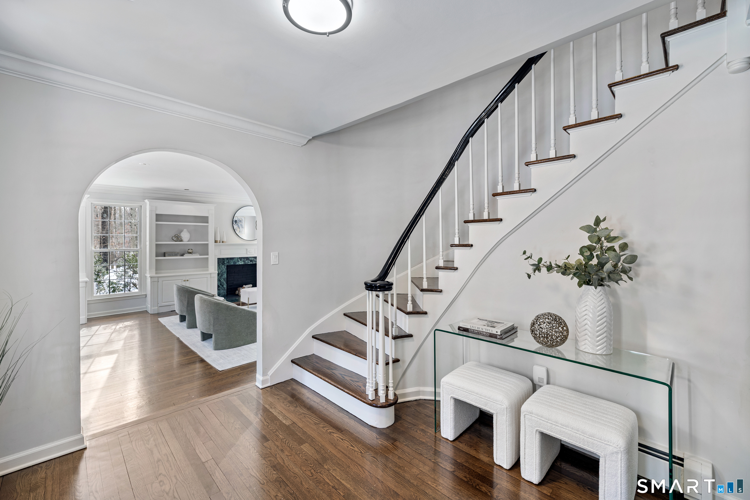 1038 West Road New Canaan, CT 06840 - Photo 3 of 37 a view of entryway and hall with wooden floor