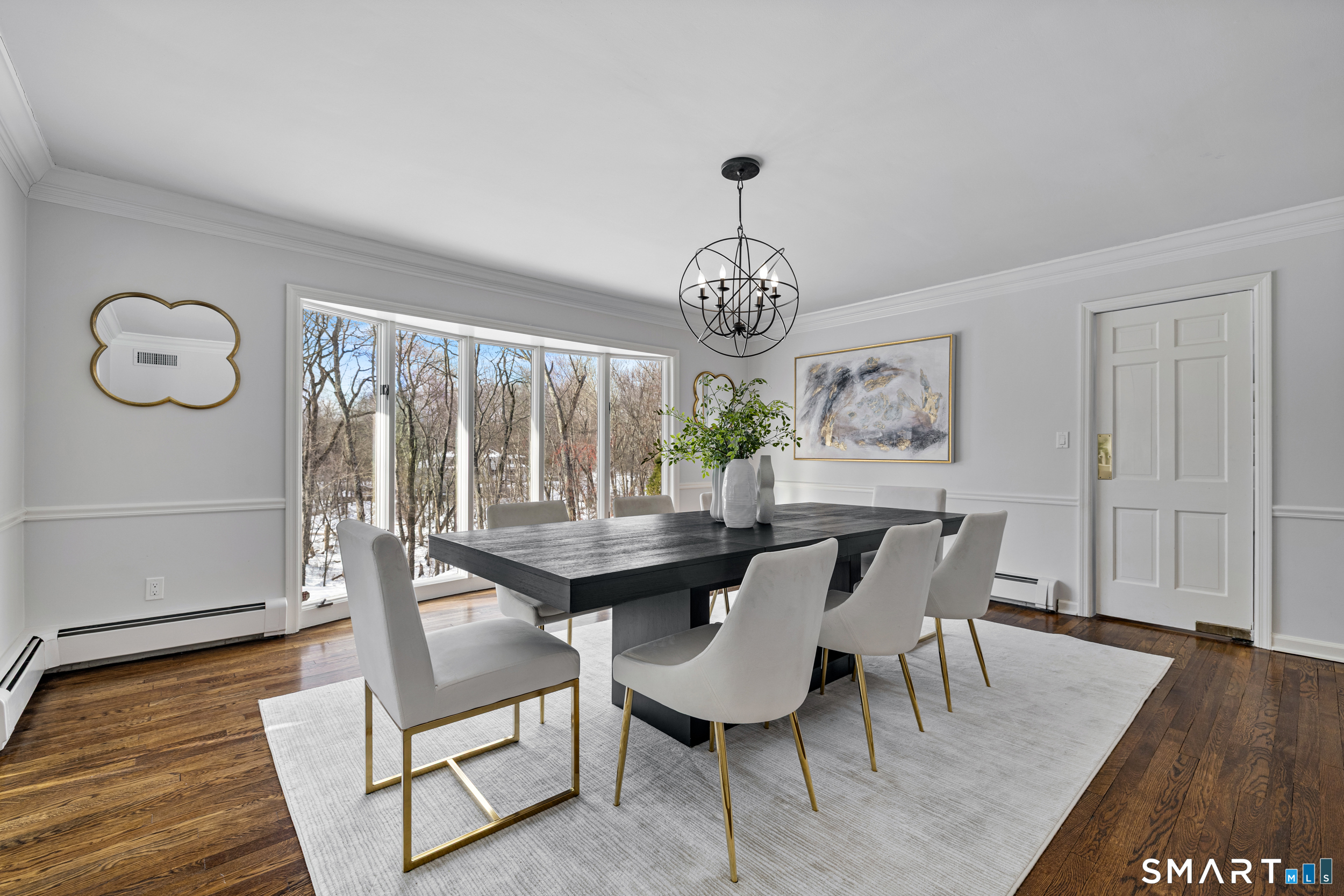 1038 West Road New Canaan, CT 06840 - Photo 5 of 37 a view of a dining room with furniture window and wooden floor