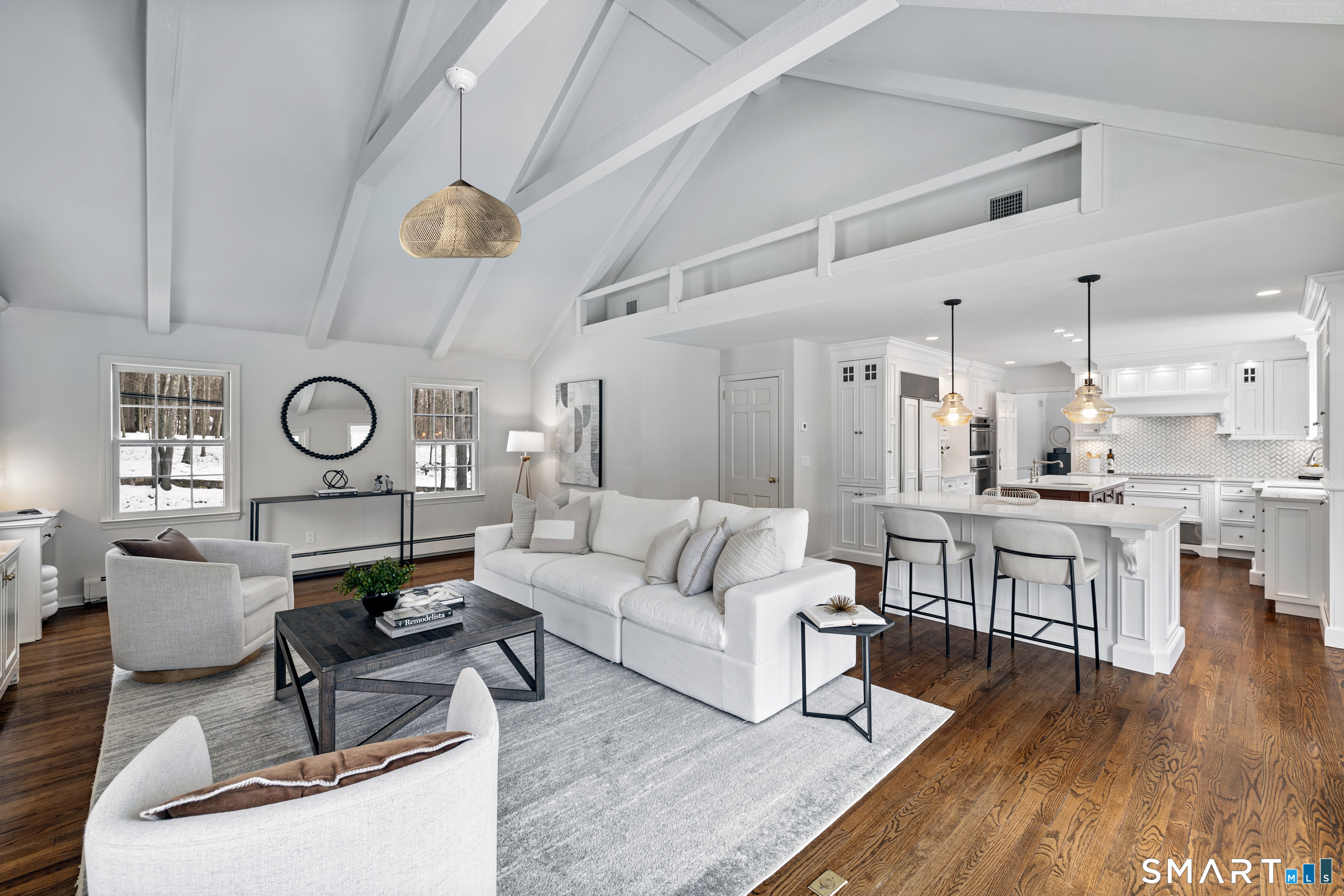 1038 West Road New Canaan, CT 06840 - Photo 10 of 37 a living room with furniture kitchen view and a table