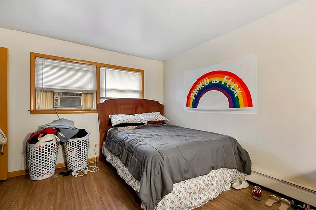 a bedroom with a bed and a window