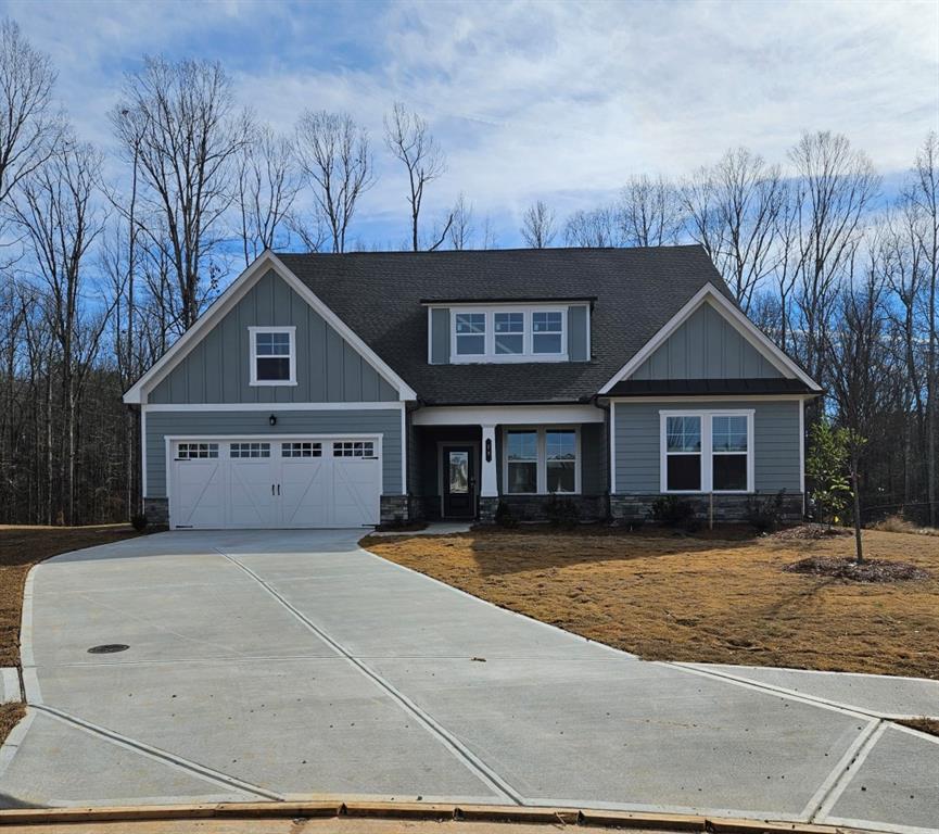 79 Black Rock Ridge Sharpsburg, GA 30277 - Photo 1 of 1 a front view of house with yard and trees in the background