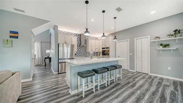 a kitchen with appliances and cabinets