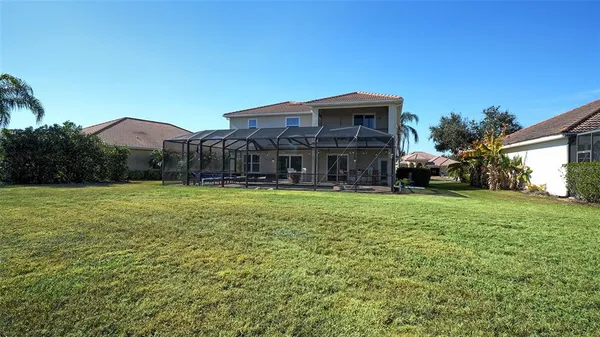 an aerial view of a residential houses with outdoor space and street view