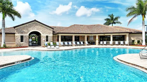a swimming pool with wooden fence