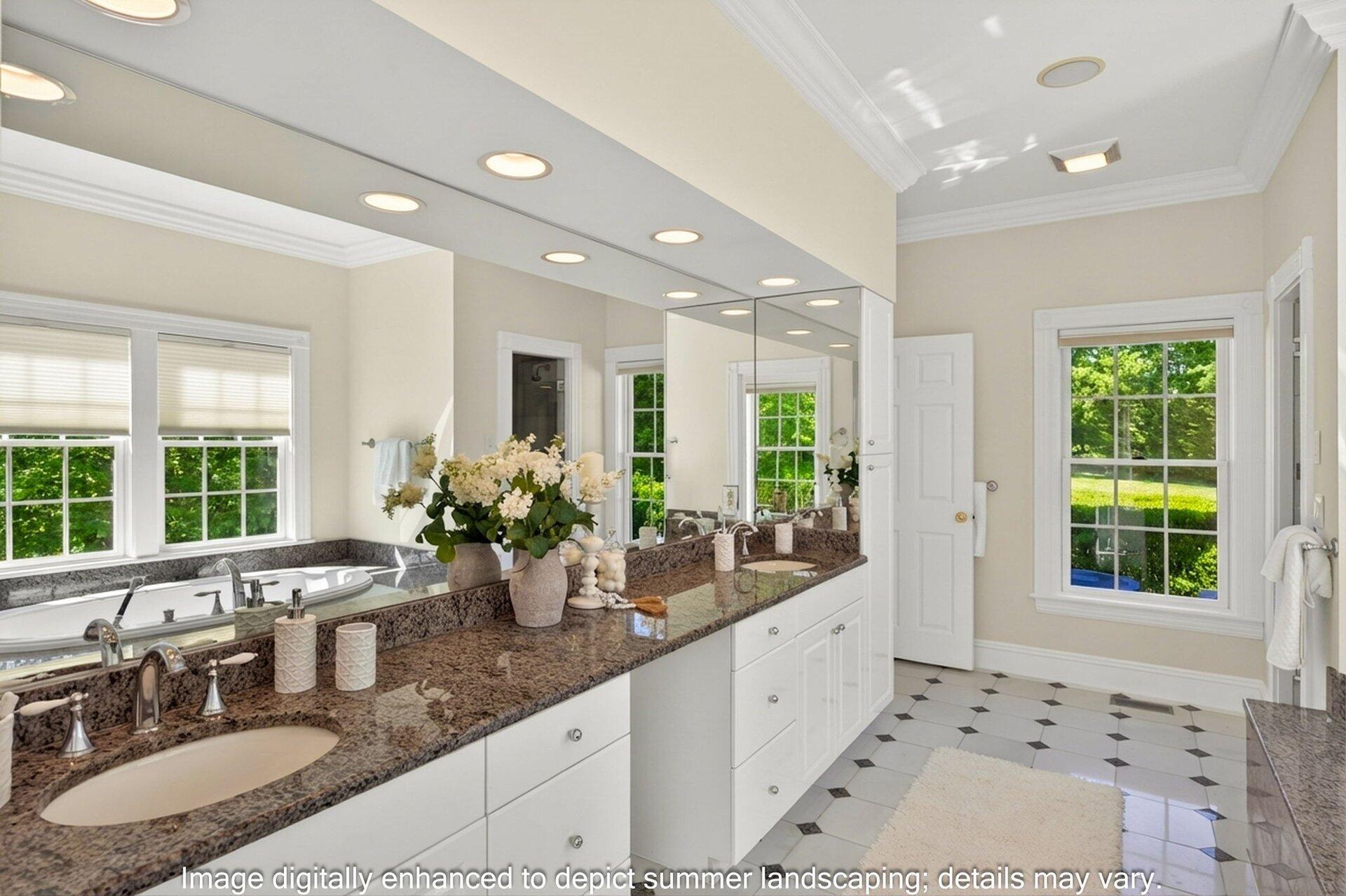 44 Seapuit Road Osterville, MA 02655 - Photo 18 of 33 a bathroom with sinks a large mirror and a bathtub next to a window