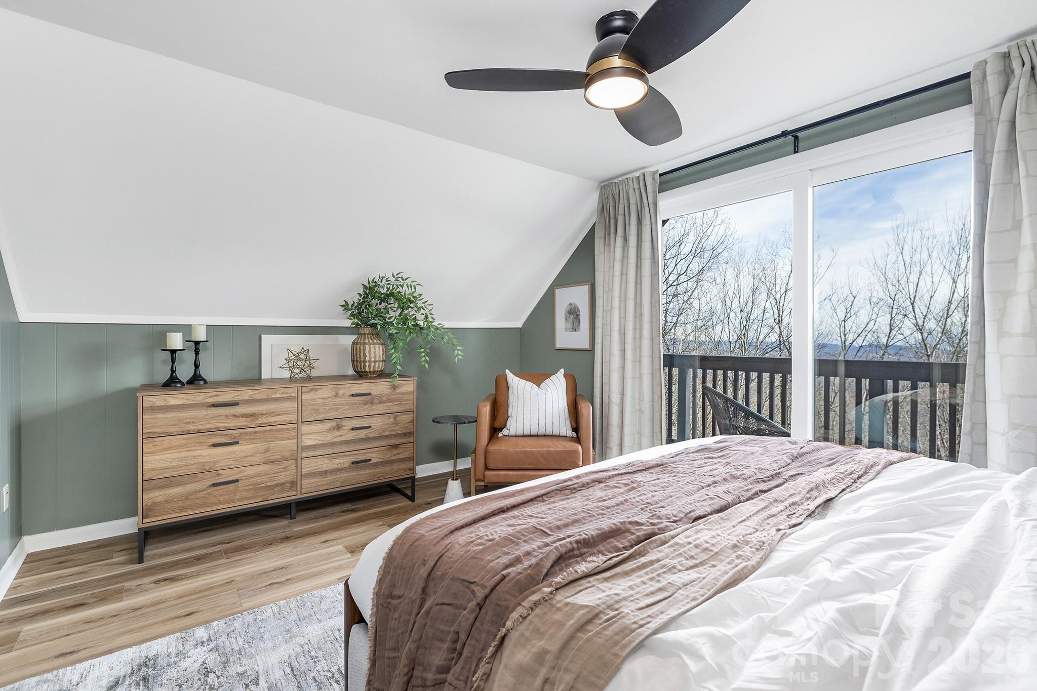 556-558 Thorncliff Drive Seven Devils, NC 28604 - Photo 12 of 48 a bedroom with a bed and a large window