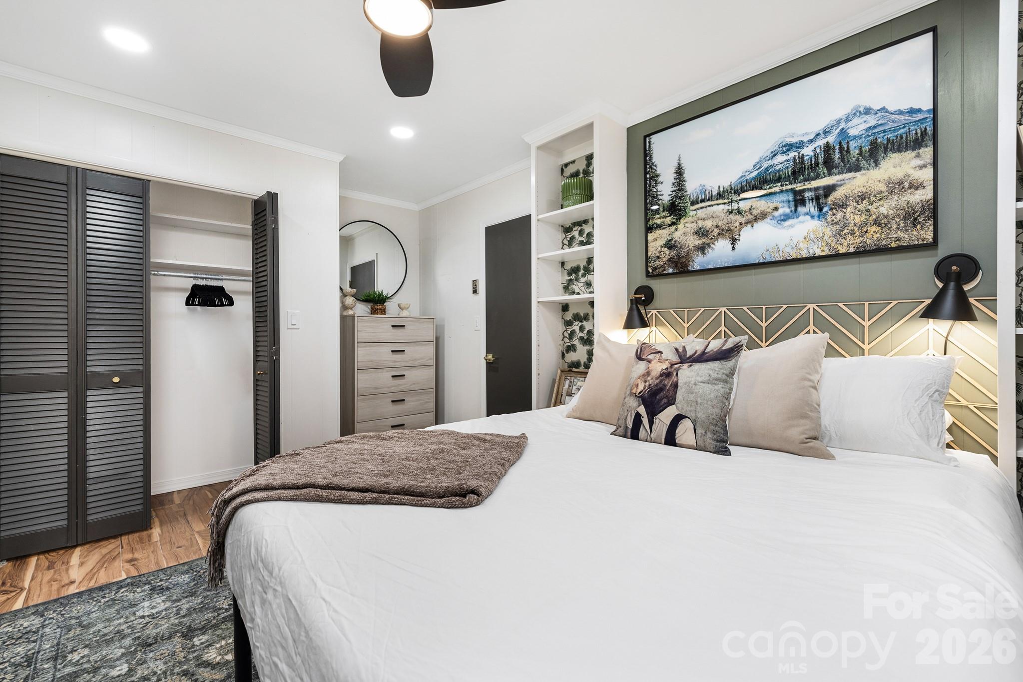 556-558 Thorncliff Drive Seven Devils, NC 28604 - Photo 17 of 48 a bedroom with a large bed and a painting on the wall