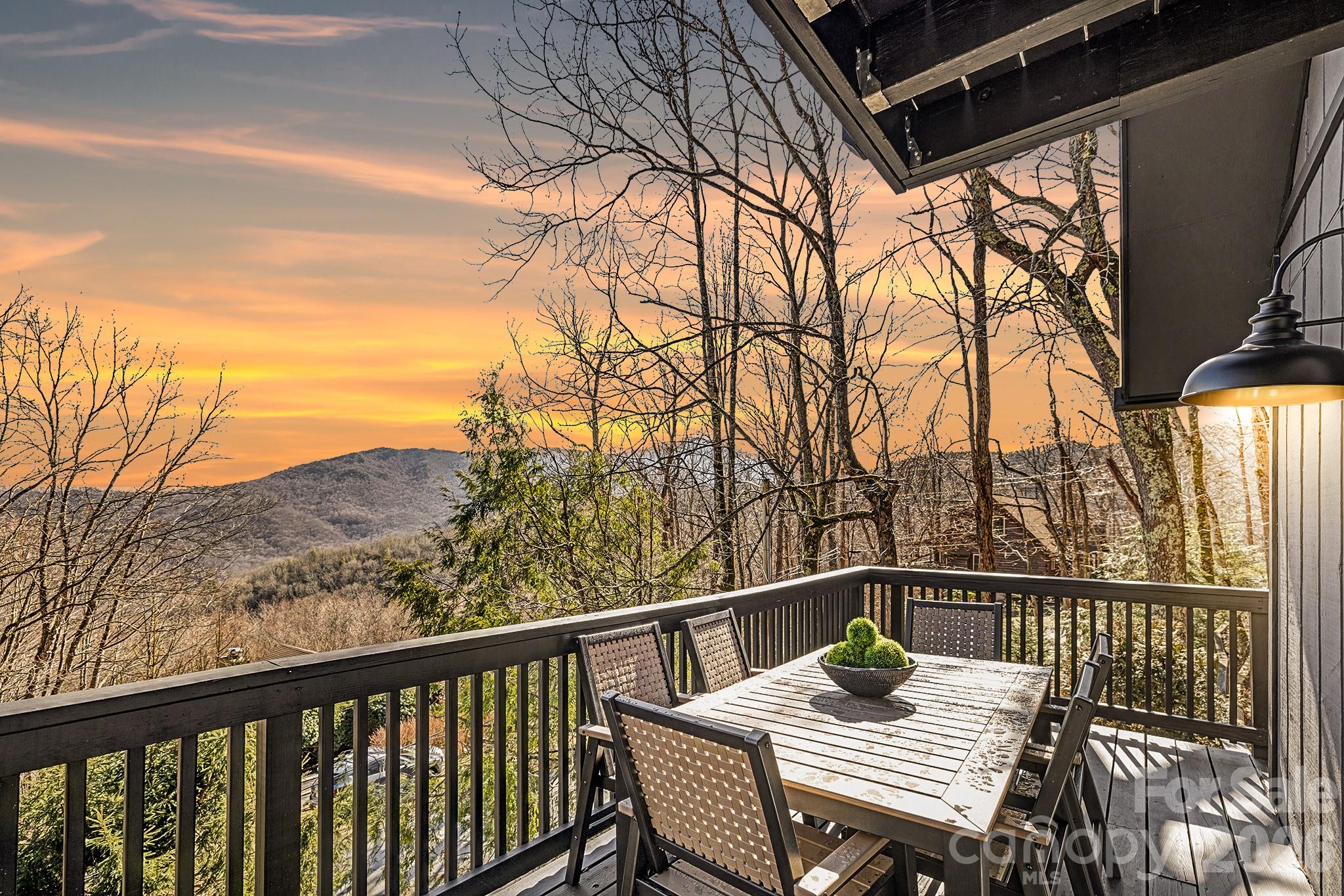 556-558 Thorncliff Drive Seven Devils, NC 28604 - Photo 2 of 48 a view of a balcony with wooden floor and fence
