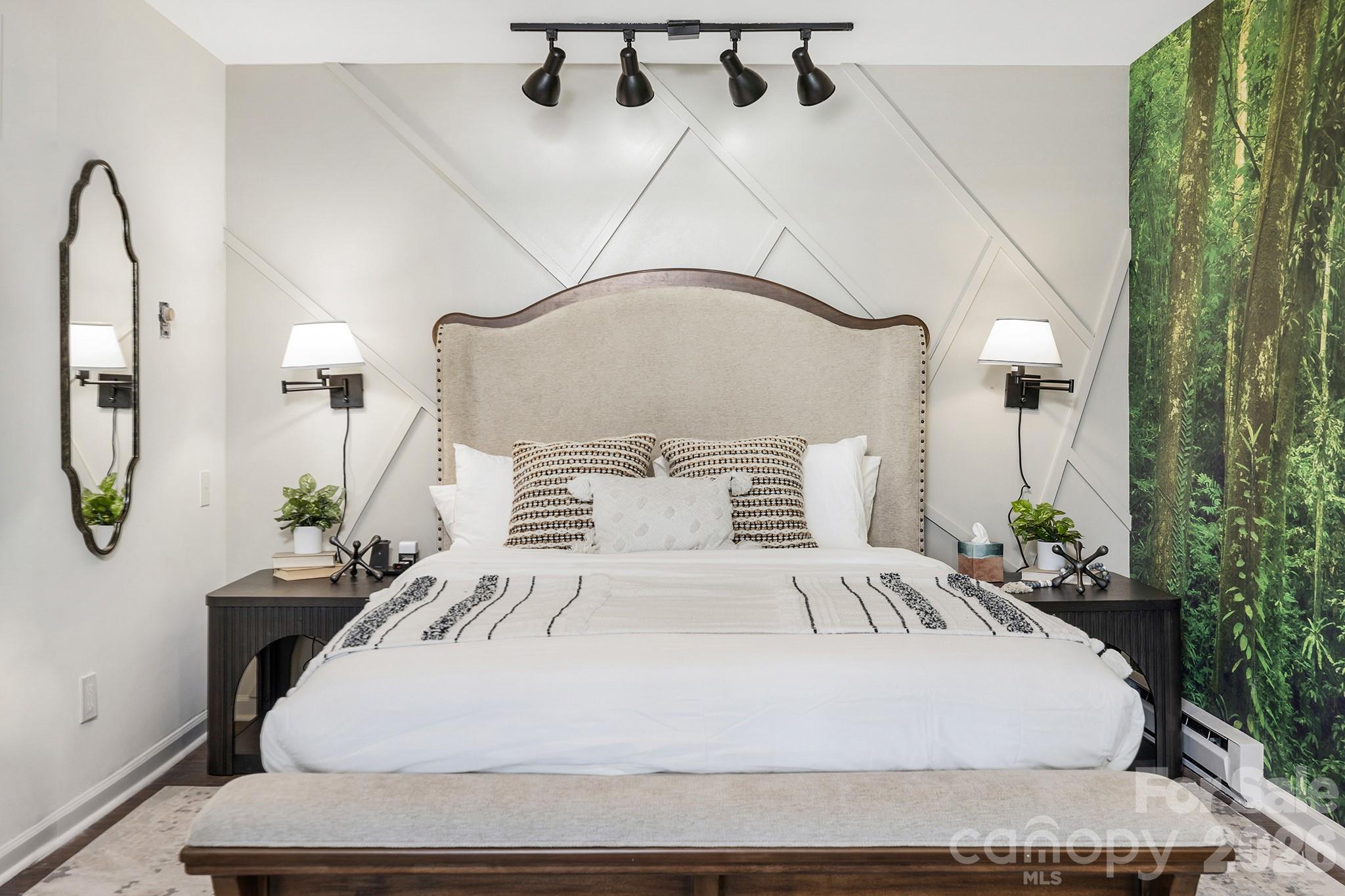 556-558 Thorncliff Drive Seven Devils, NC 28604 - Photo 21 of 48 a large white bed in a bedroom next to a window