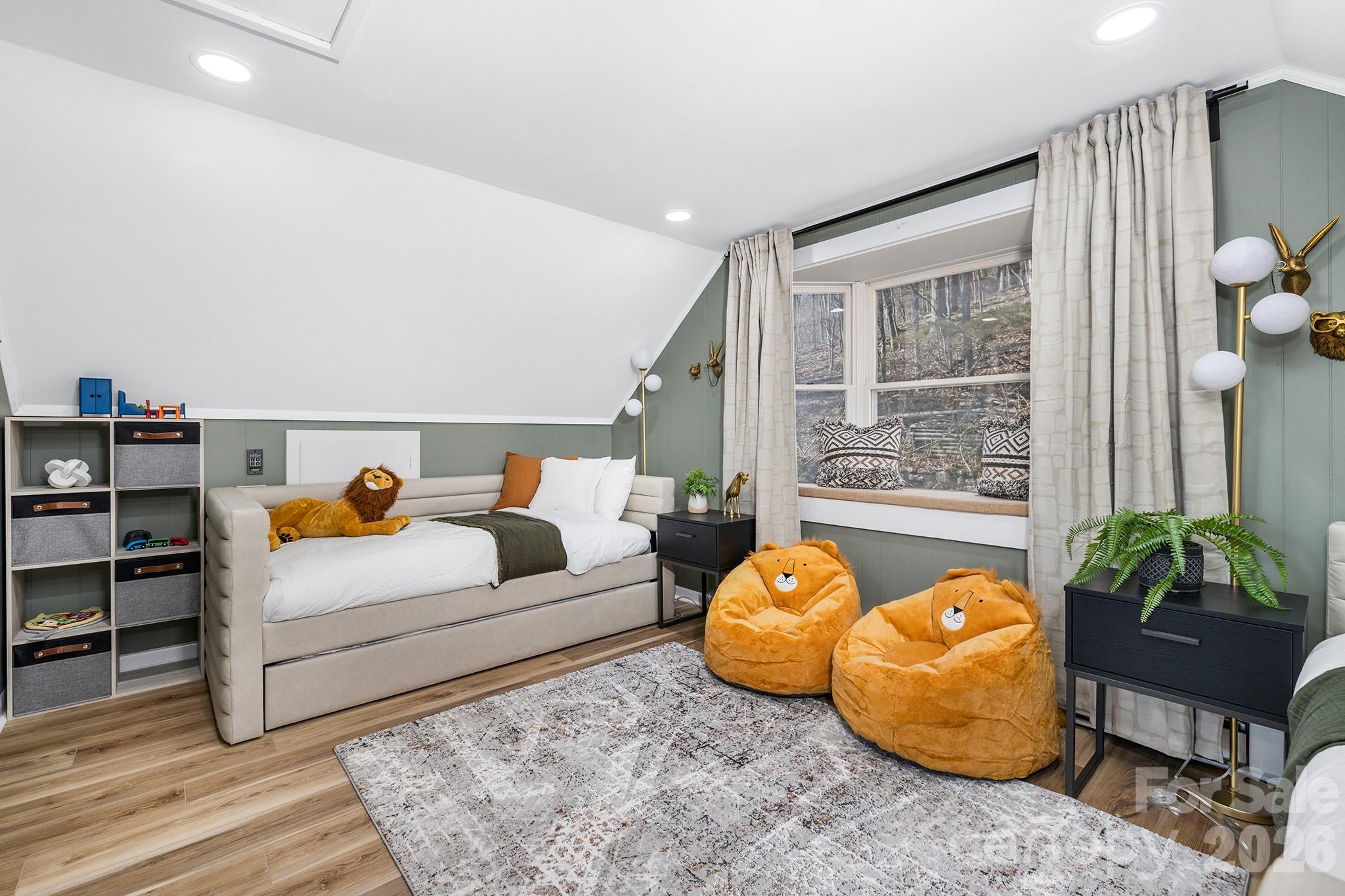 556-558 Thorncliff Drive Seven Devils, NC 28604 - Photo 26 of 48 a living room with furniture and a potted plant