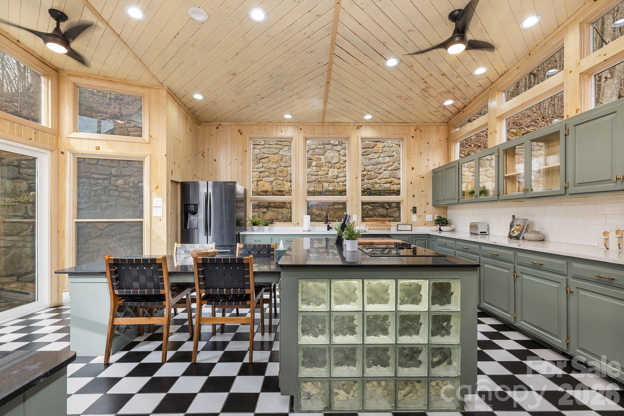 556-558 Thorncliff Drive Seven Devils, NC 28604 - Photo 29 of 48 a kitchen with stainless steel appliances granite countertop a stove and a sink