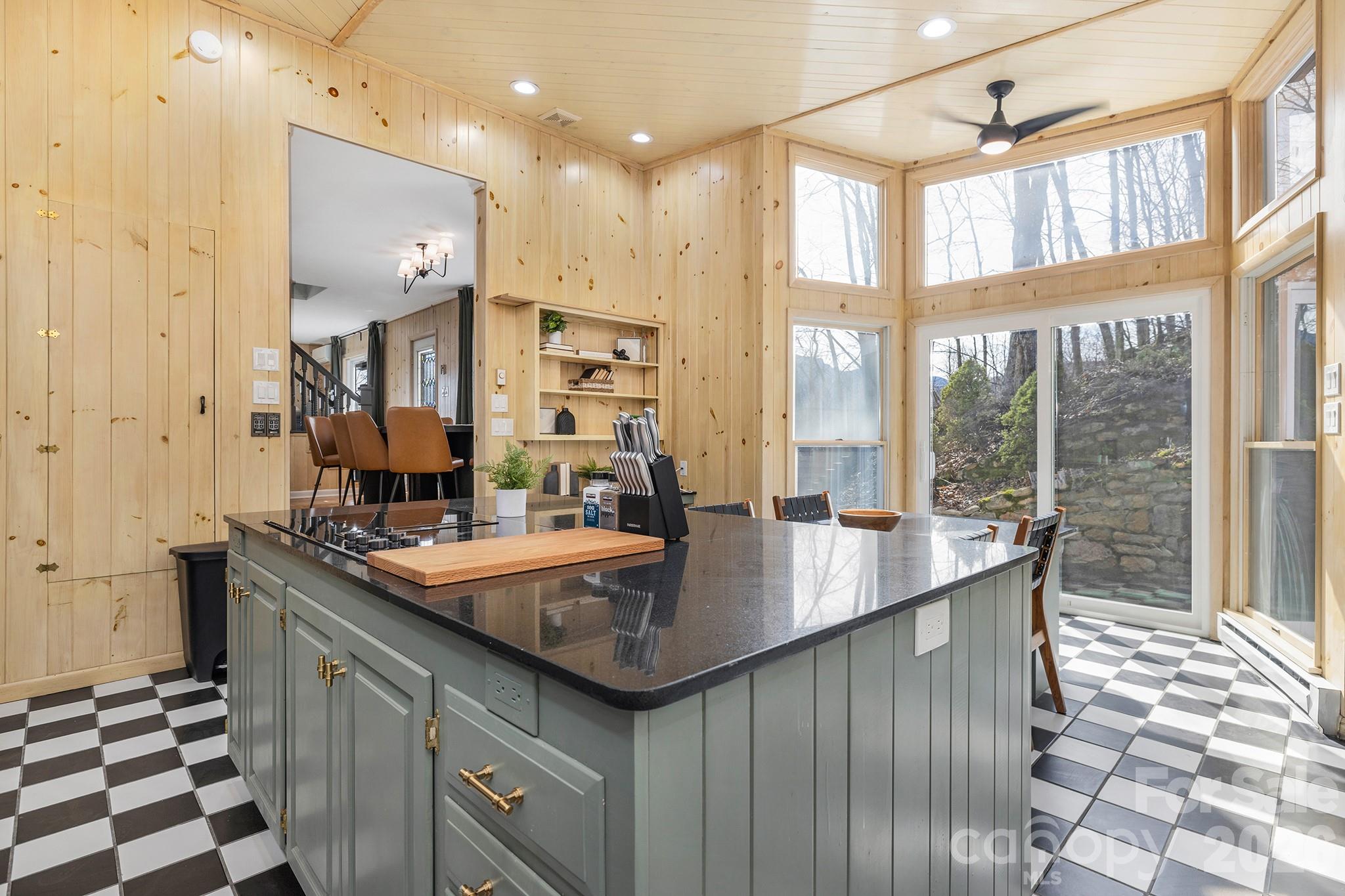 556-558 Thorncliff Drive Seven Devils, NC 28604 - Photo 30 of 48 a kitchen with kitchen island granite countertop a sink and a window