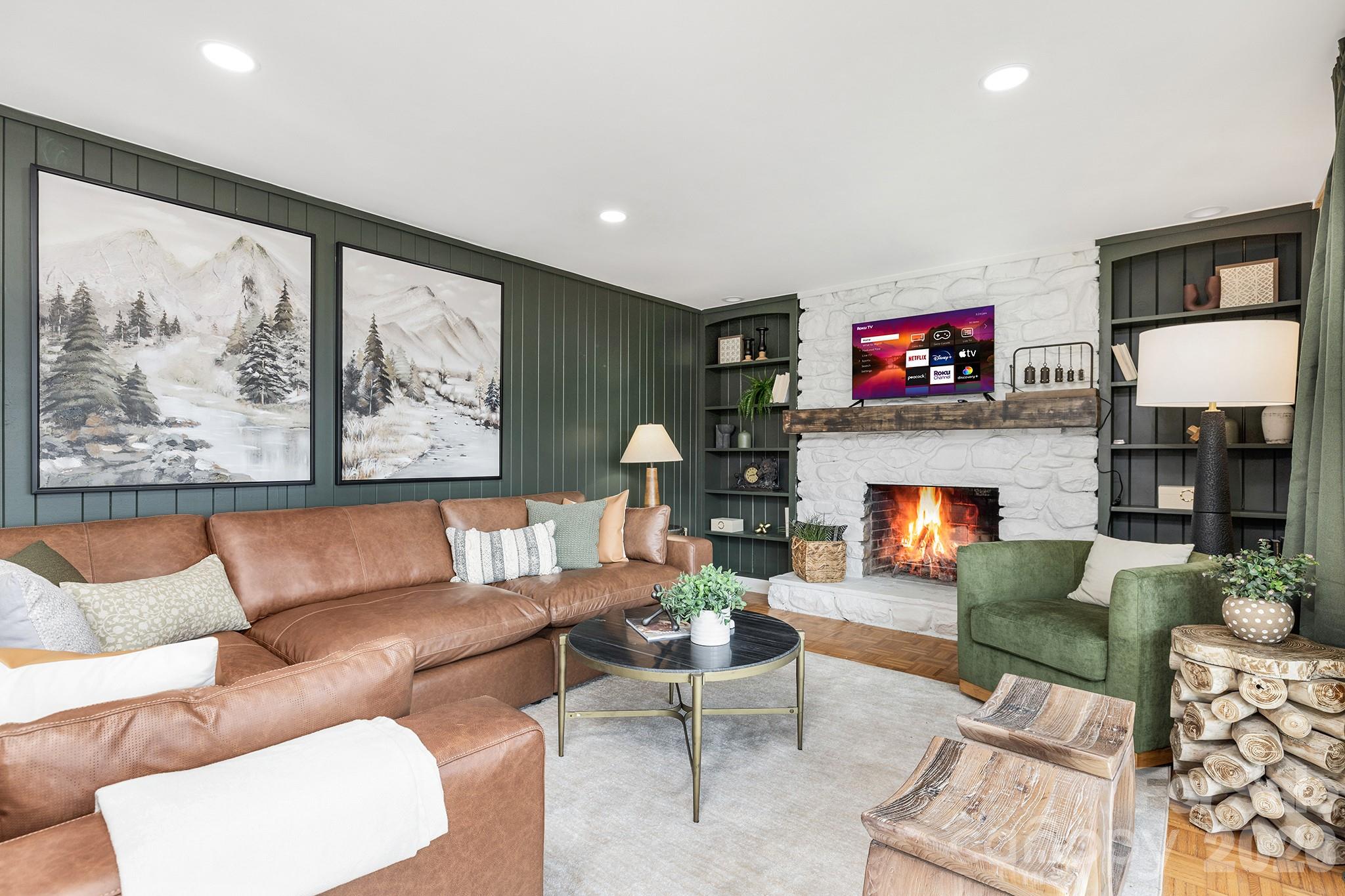 556-558 Thorncliff Drive Seven Devils, NC 28604 - Photo 3 of 48 a living room with furniture a flat screen tv and a fireplace