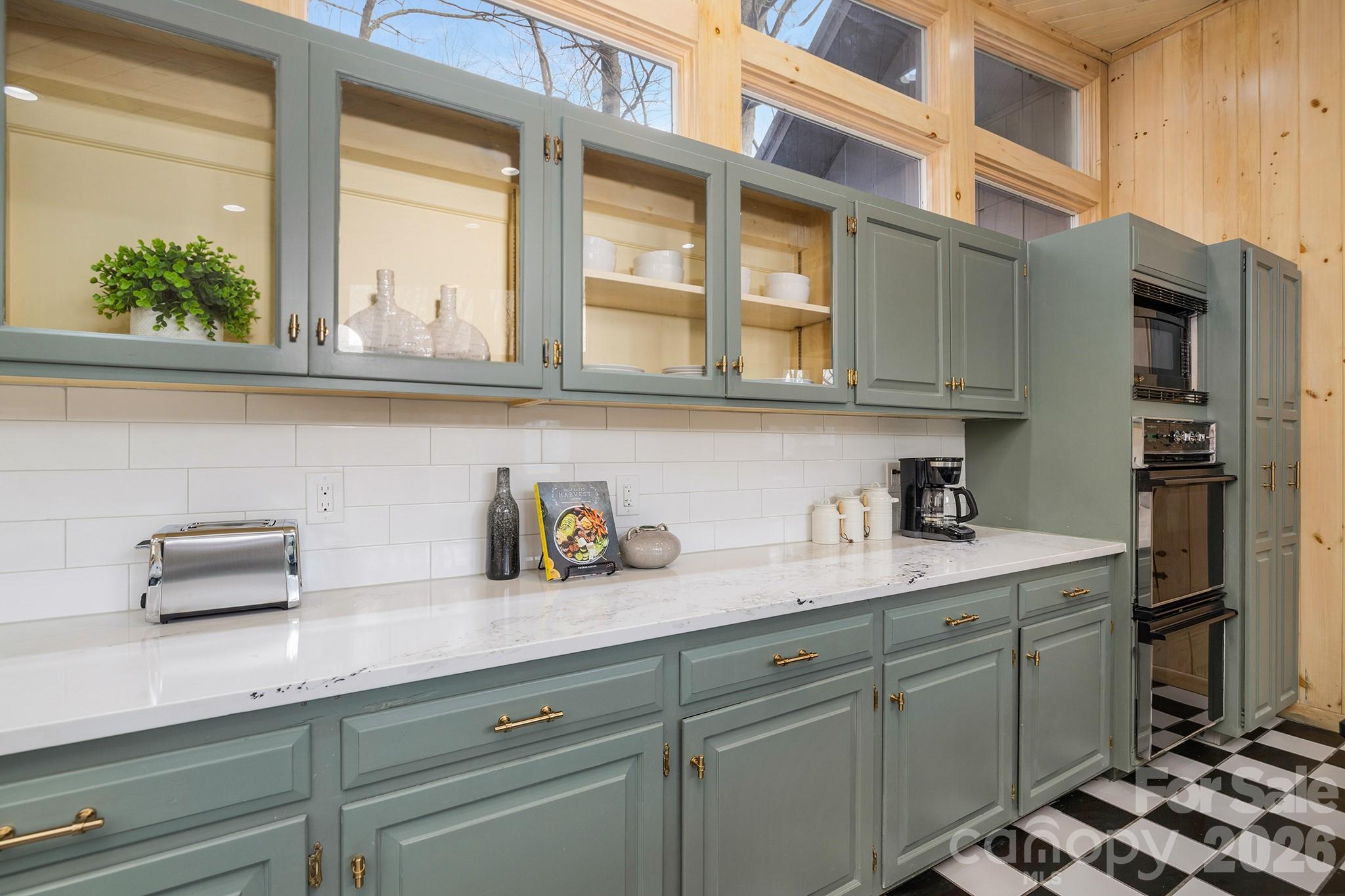556-558 Thorncliff Drive Seven Devils, NC 28604 - Photo 31 of 48 a kitchen with stainless steel appliances a sink and cabinets