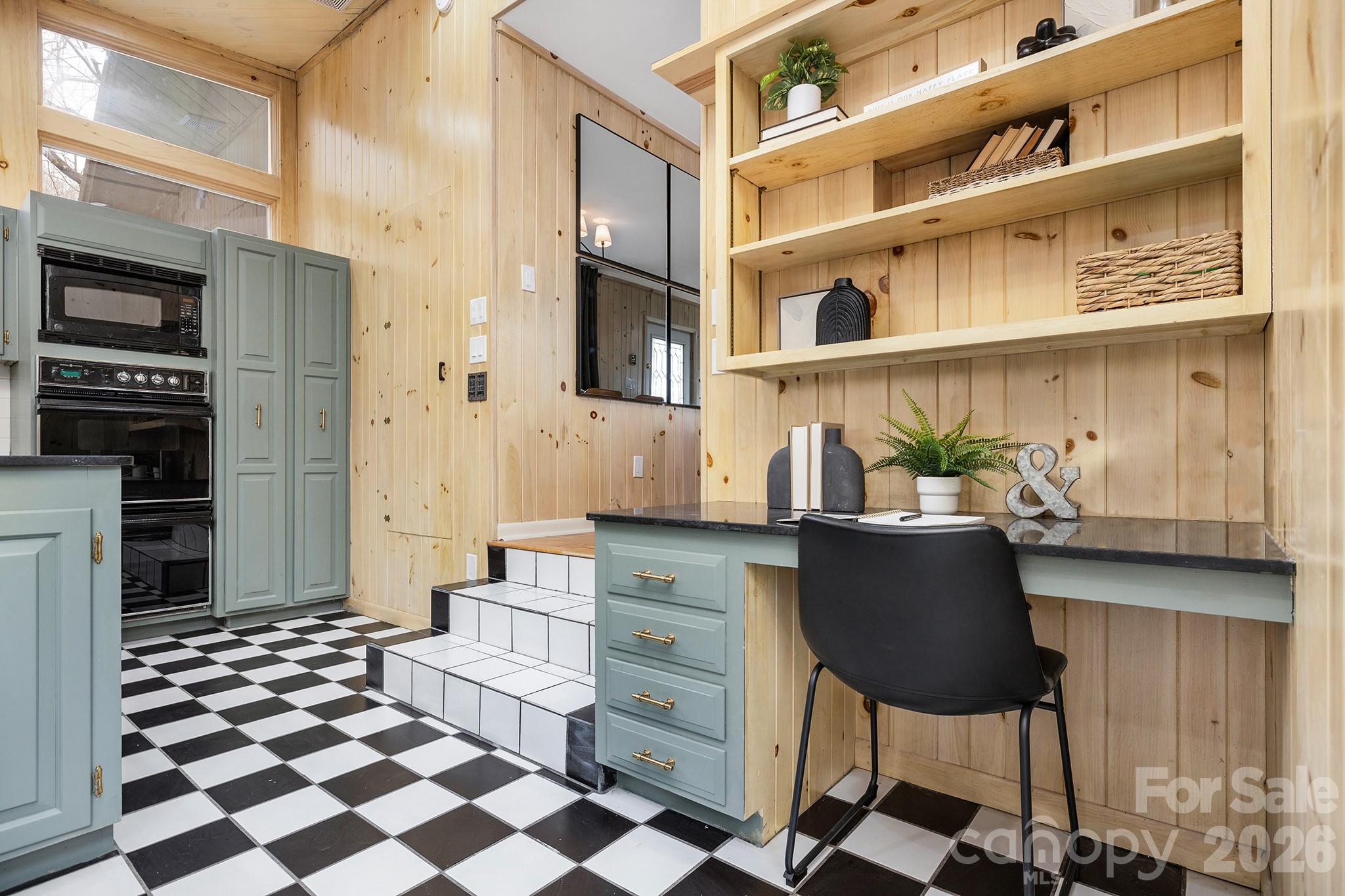 556-558 Thorncliff Drive Seven Devils, NC 28604 - Photo 32 of 48 a kitchen with stainless steel appliances granite countertop a refrigerator and a stove top oven