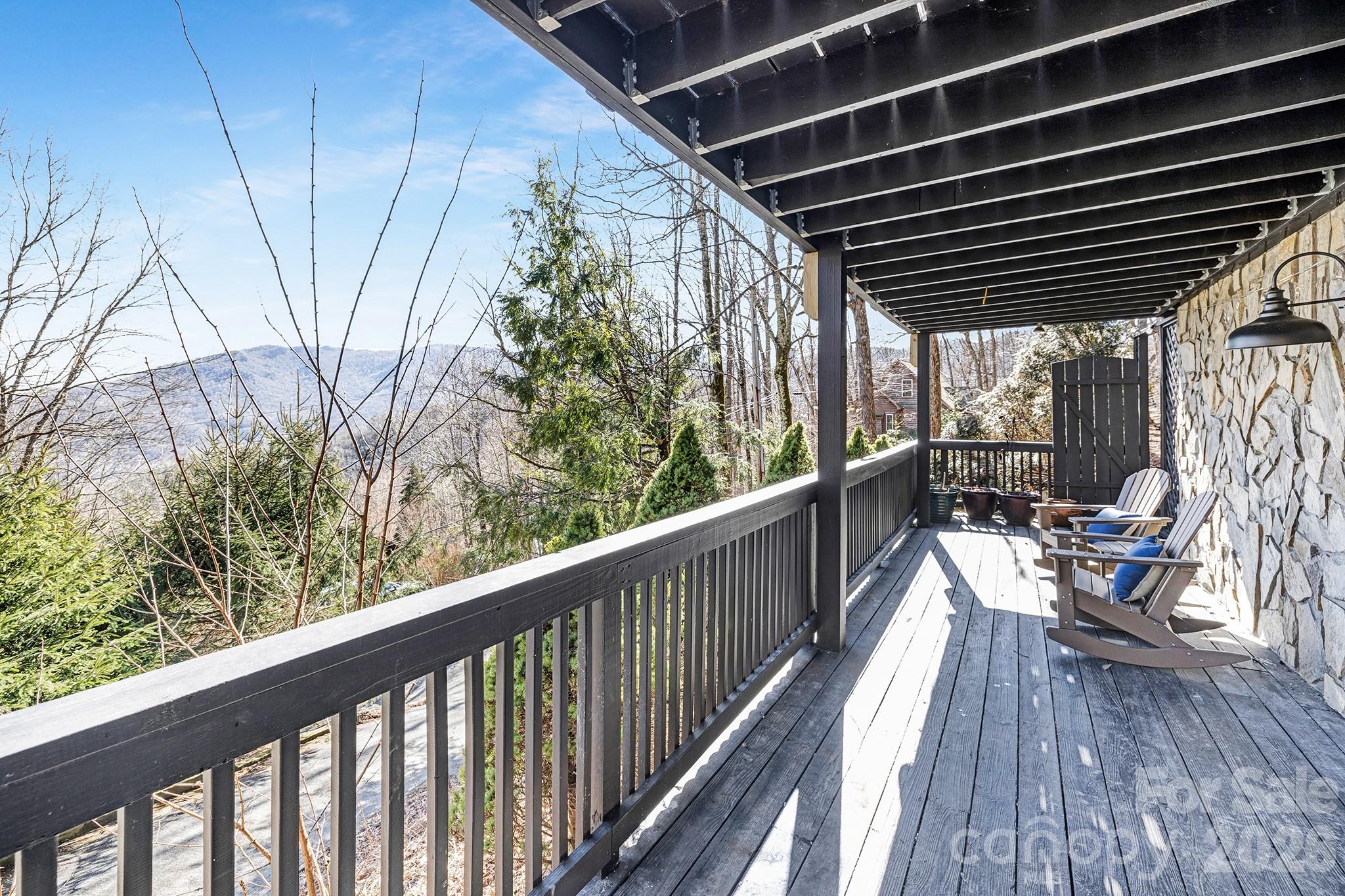 556-558 Thorncliff Drive Seven Devils, NC 28604 - Photo 36 of 48 a view of a balcony with chairs
