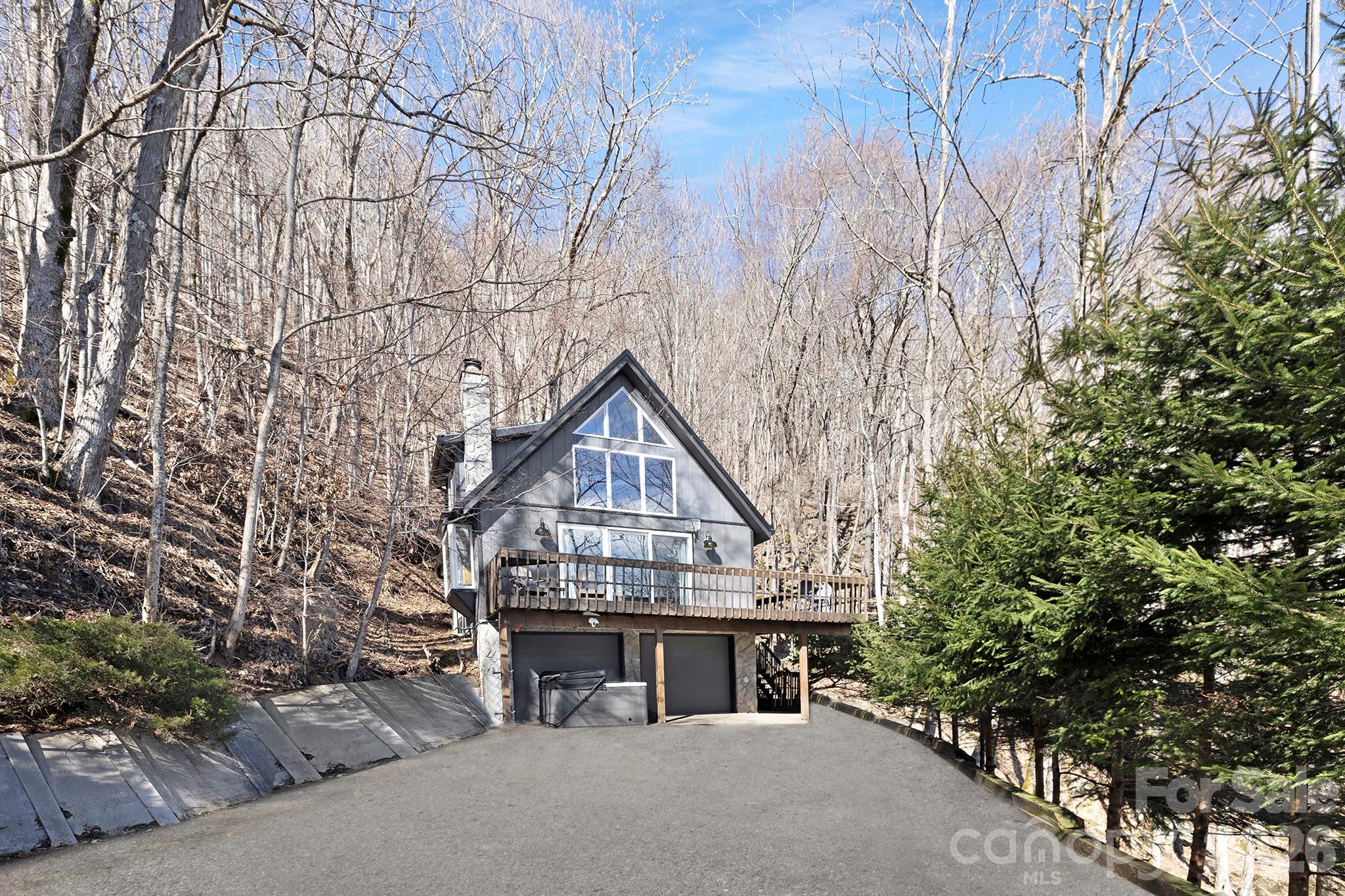 556-558 Thorncliff Drive Seven Devils, NC 28604 - Photo 37 of 48 front view of a house with a dry yard