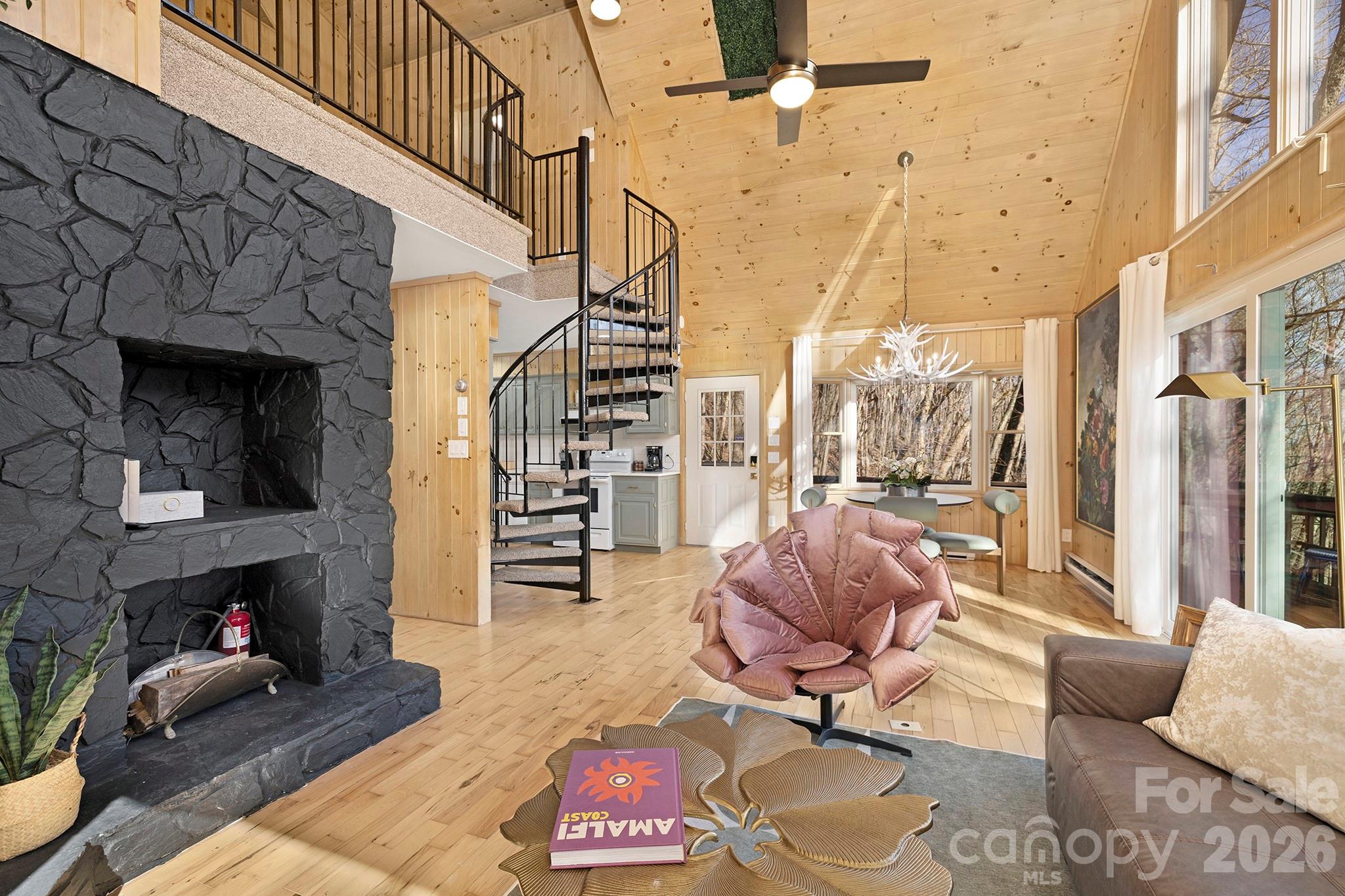 556-558 Thorncliff Drive Seven Devils, NC 28604 - Photo 38 of 48 a living room with furniture and a fireplace