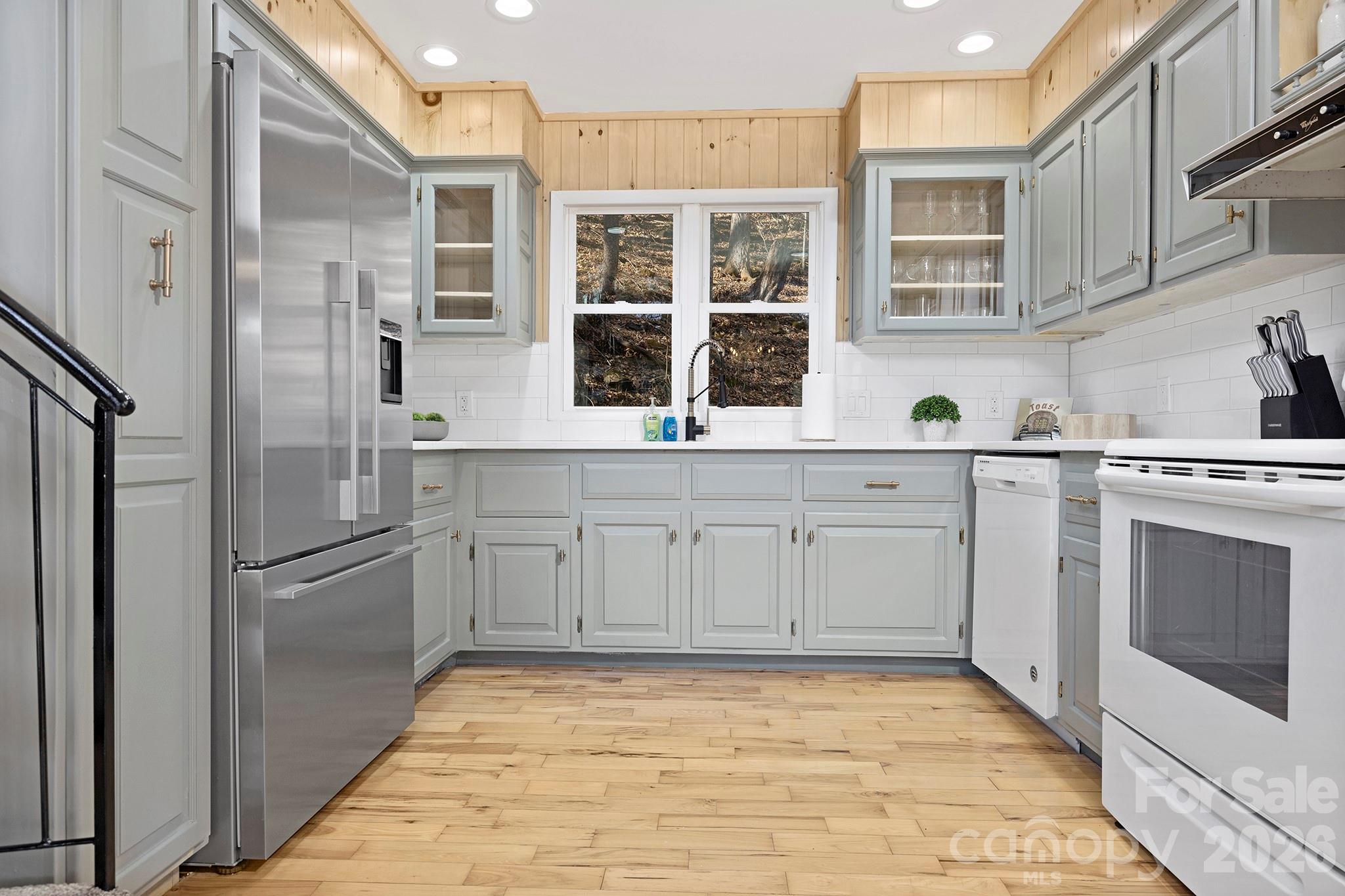 556-558 Thorncliff Drive Seven Devils, NC 28604 - Photo 42 of 48 a kitchen with stainless steel appliances a stove sink and refrigerator