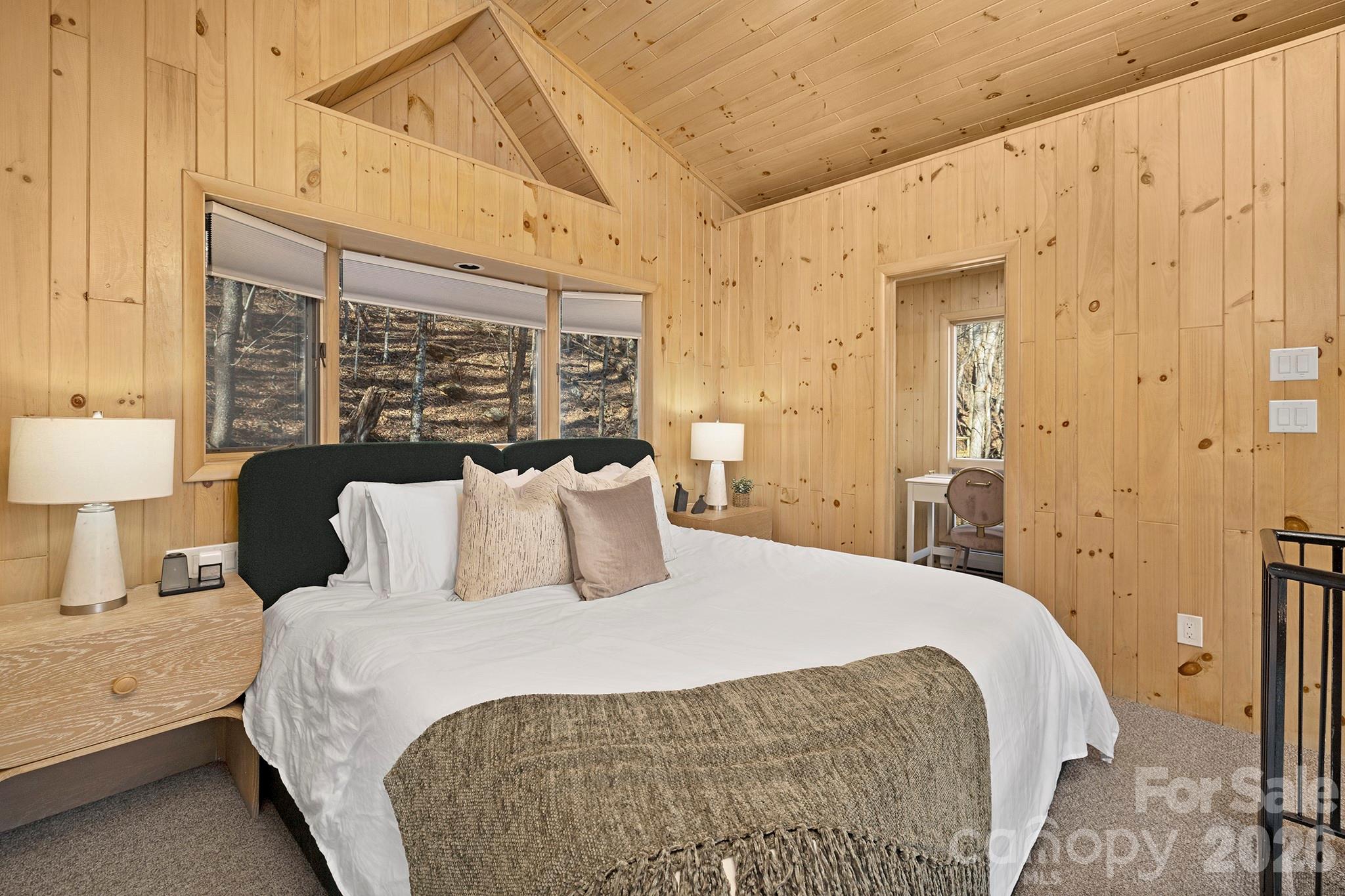 556-558 Thorncliff Drive Seven Devils, NC 28604 - Photo 43 of 48 a large bed sitting in a bedroom next to a window