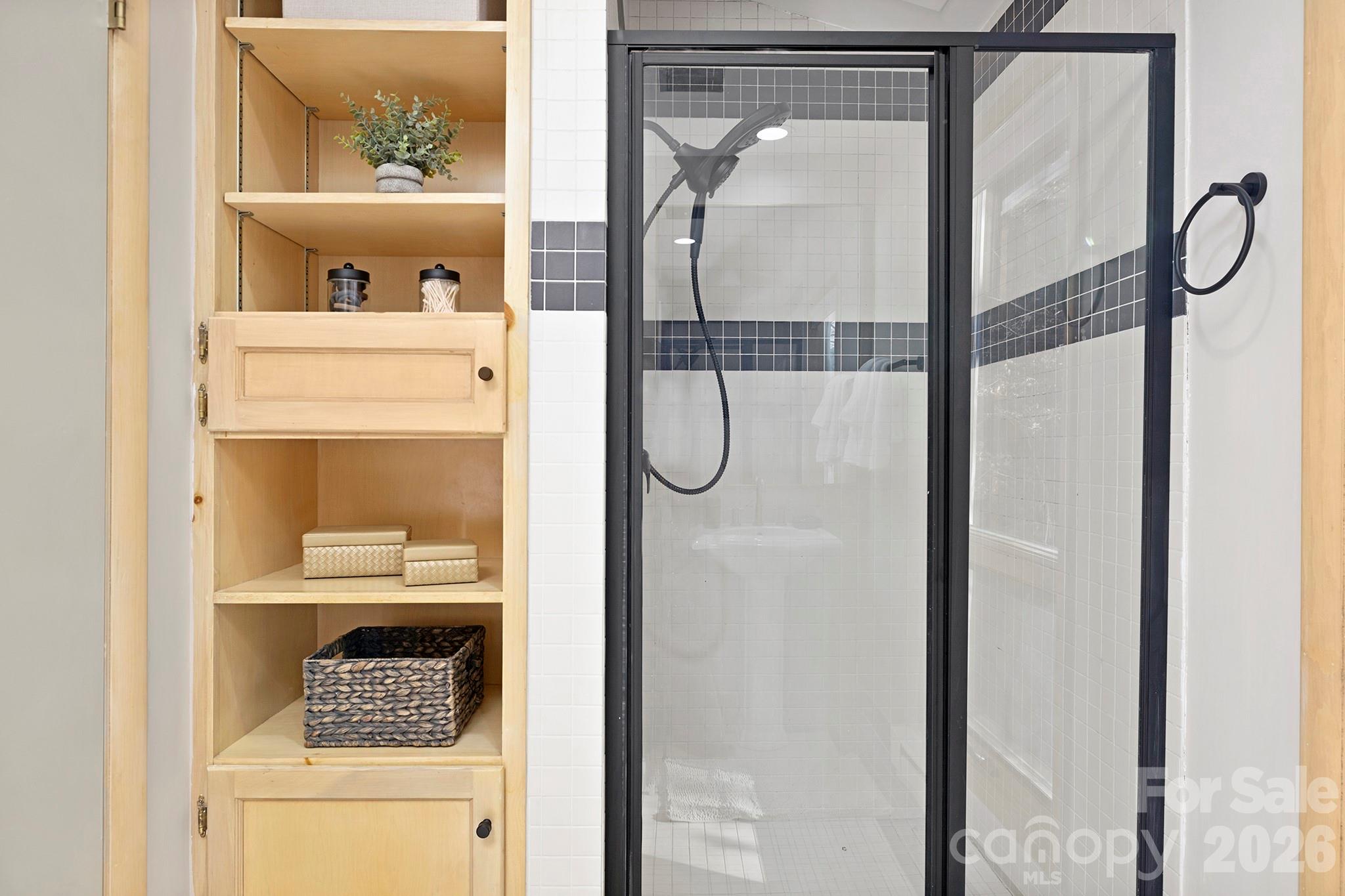 556-558 Thorncliff Drive Seven Devils, NC 28604 - Photo 45 of 48 a picture of a bathroom with a glass shower door