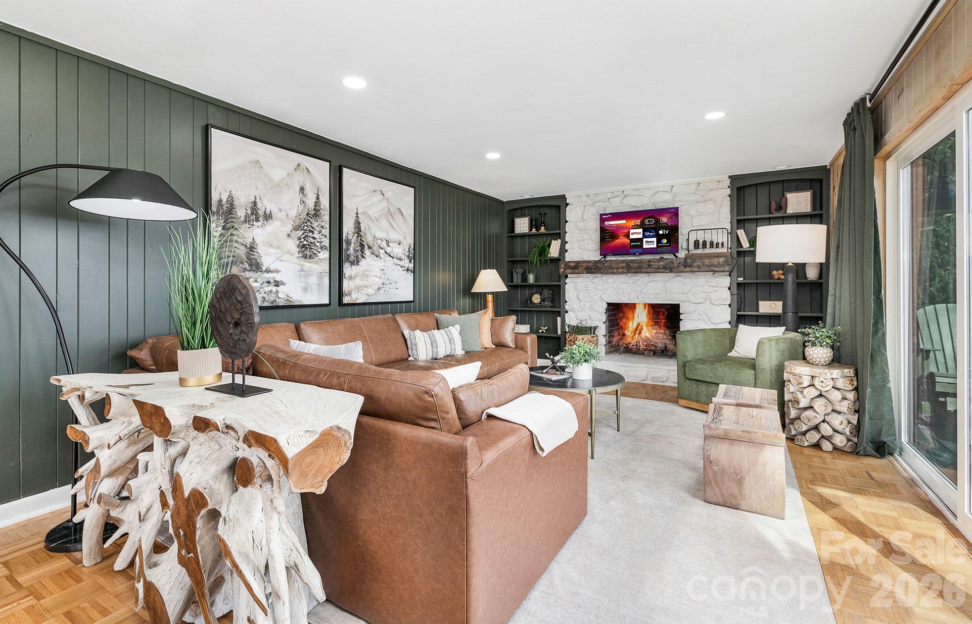 556-558 Thorncliff Drive Seven Devils, NC 28604 - Photo 6 of 48 a living room with furniture and a flat screen tv