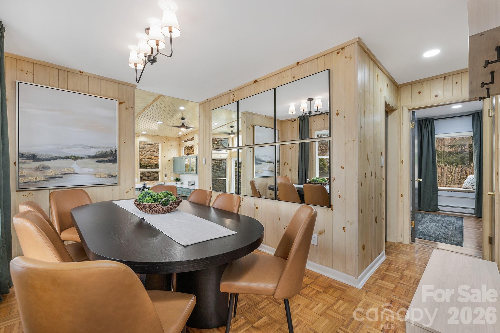 556-558 Thorncliff Drive Seven Devils, NC 28604 - Photo 9 of 48 a view of a dining room with furniture window and outside view