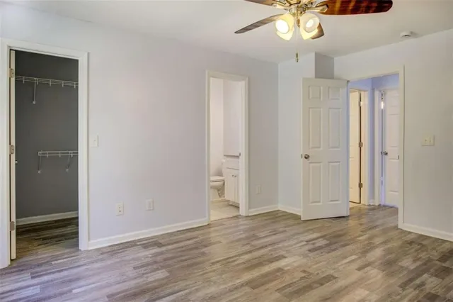 a view of a livingroom with a chandelier fan