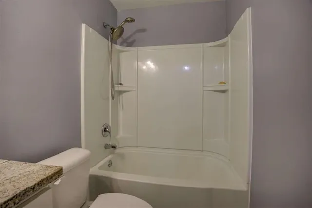 a view of a yard with large tree