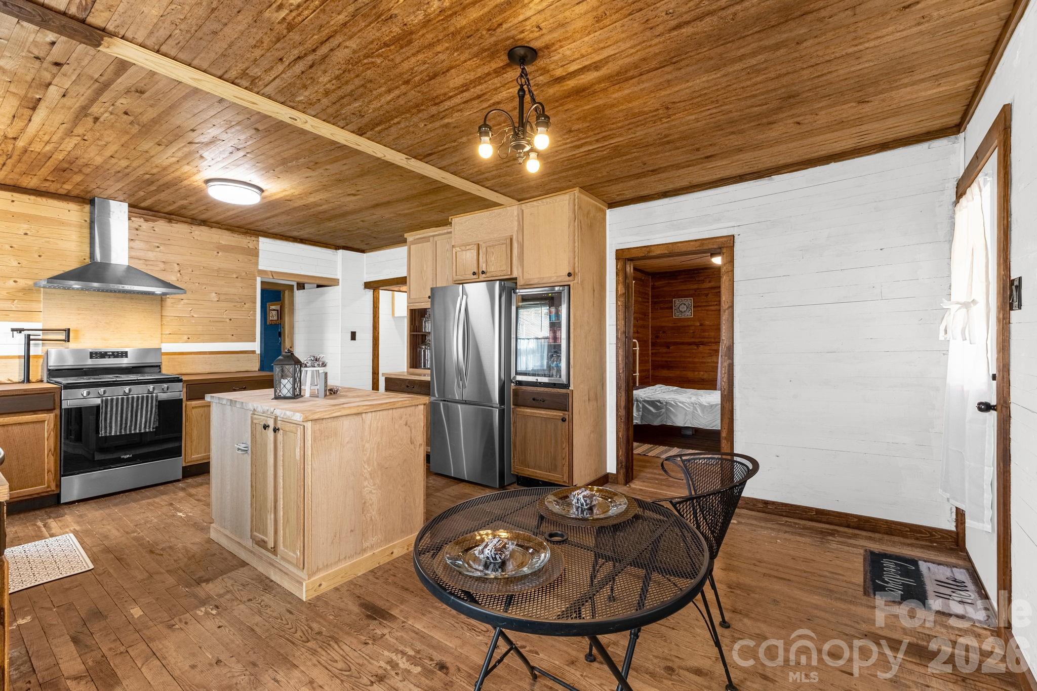 98 Poplar Springs Road Hiddenite, NC 28636 - Photo 17 of 37 a kitchen with furniture a refrigerator and a stove