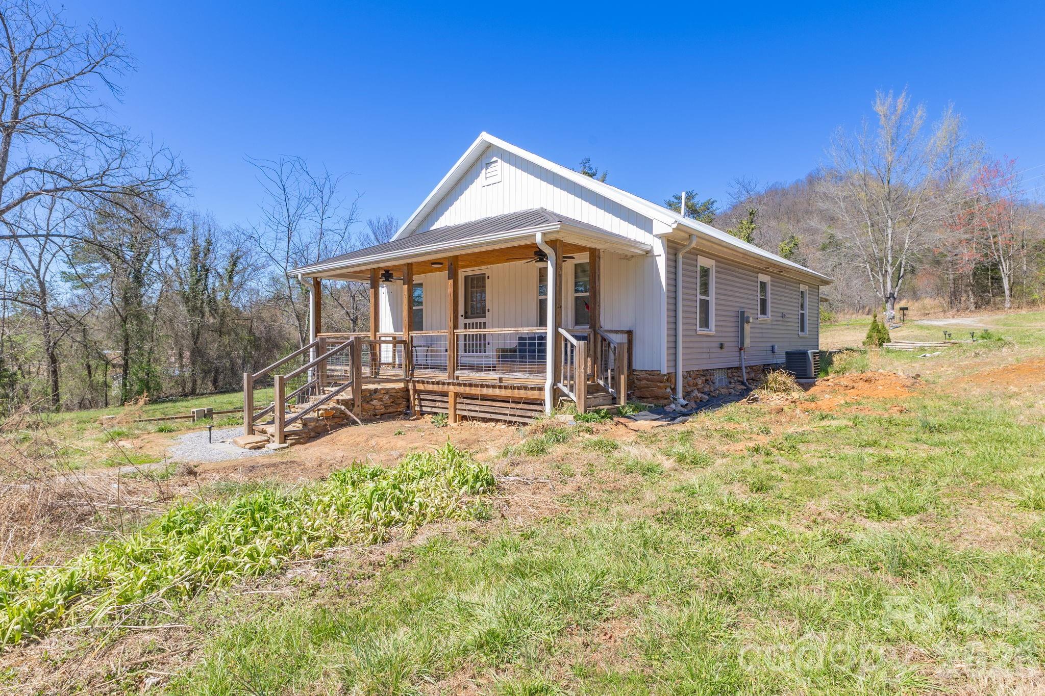 98 Poplar Springs Road Hiddenite, NC 28636 - Photo 5 of 37 a view of a house with a yard covered in snow