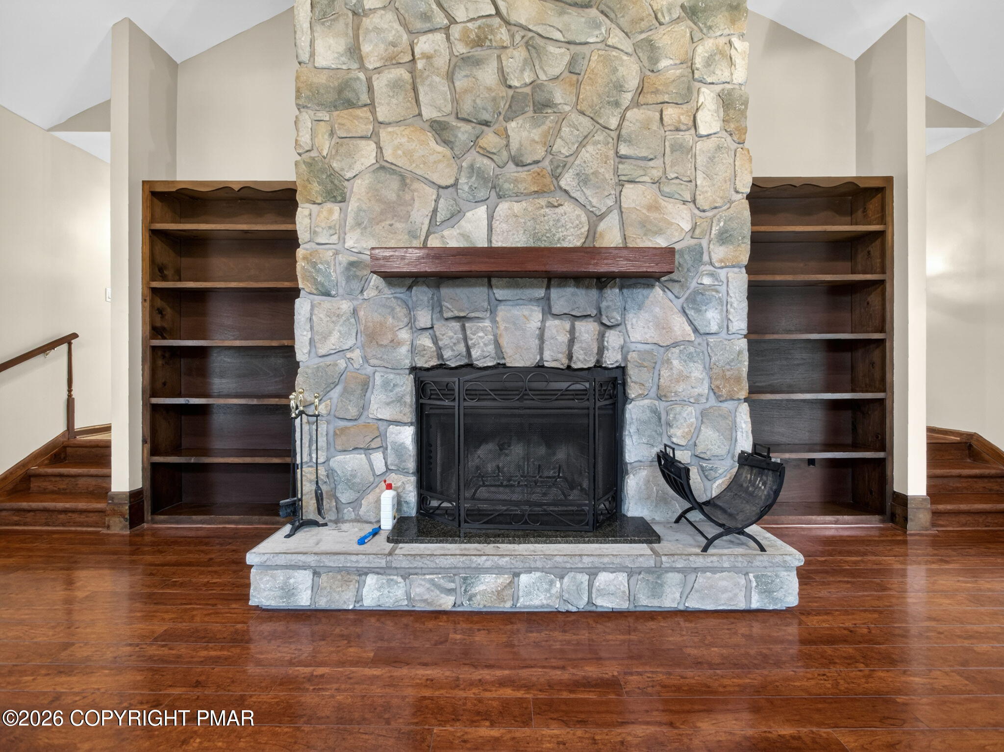 363 Blue Ridge Road Saylorsburg, PA 18353 - Photo 14 of 61 a living room with a fireplace and a wooden floor