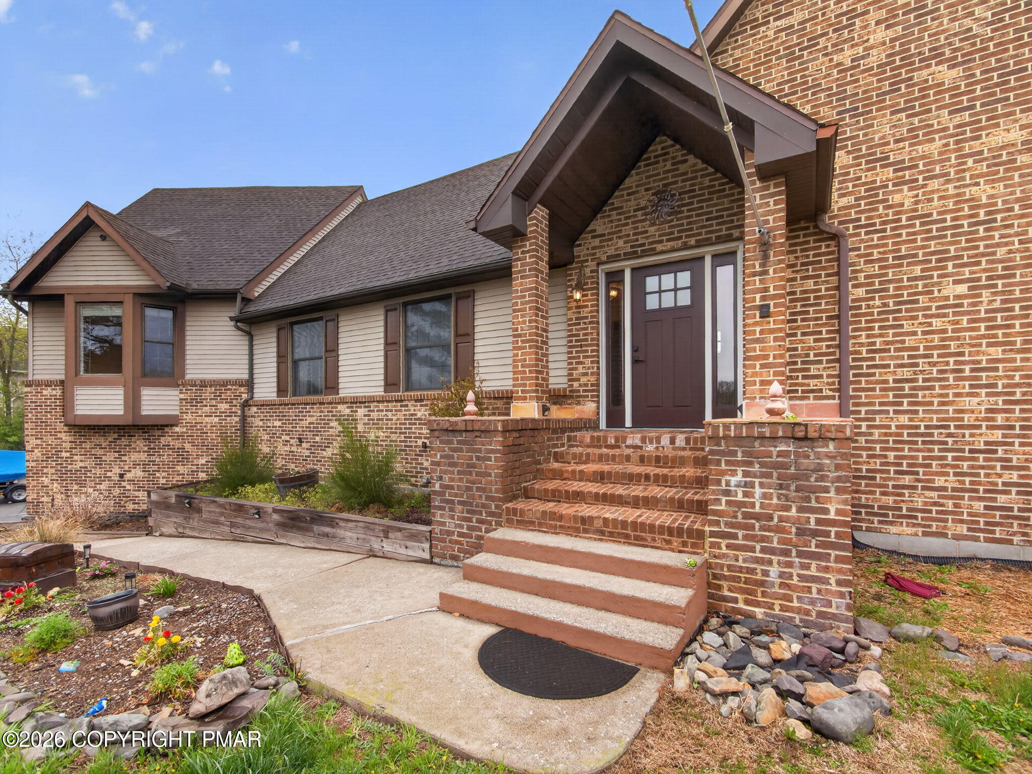 363 Blue Ridge Road Saylorsburg, PA 18353 - Photo 2 of 61 a front view of a house with garden