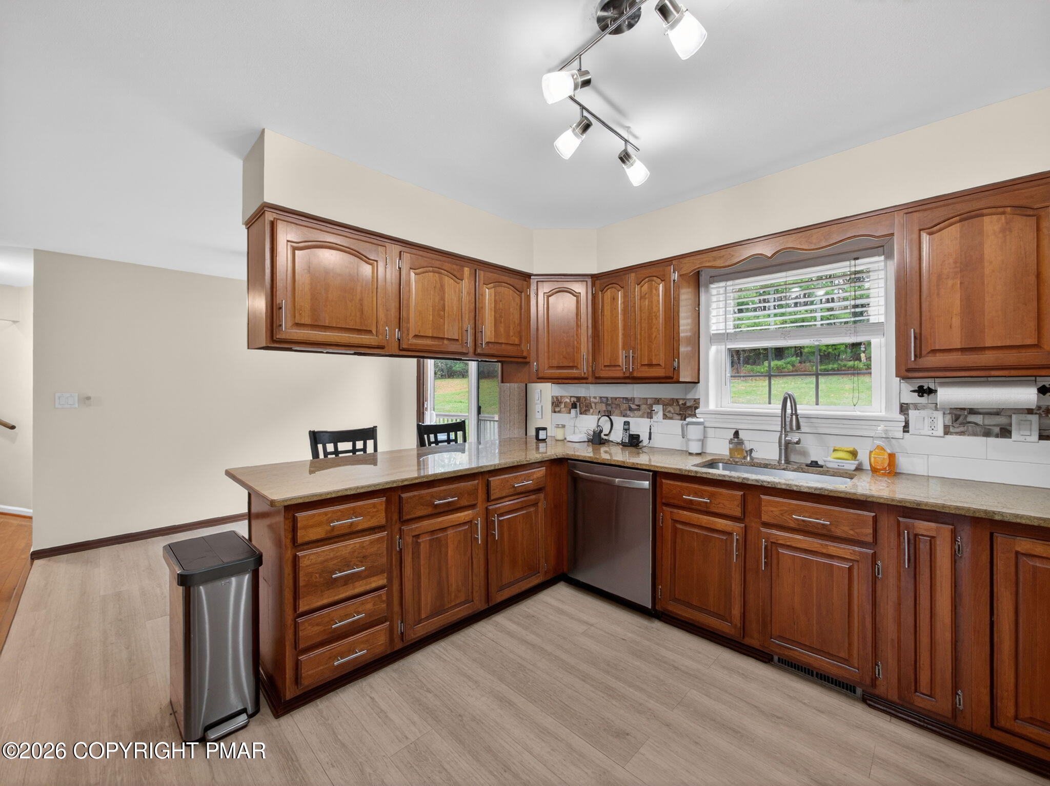 363 Blue Ridge Road Saylorsburg, PA 18353 - Photo 25 of 61 a kitchen with lots of counter space sink and wooden floor